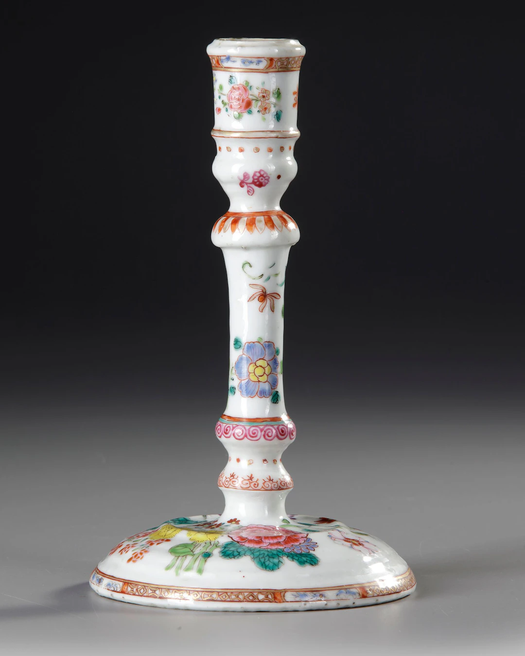 A CHINESE FAMILLE ROSE CANDLESTICK, 18TH CENTURY
