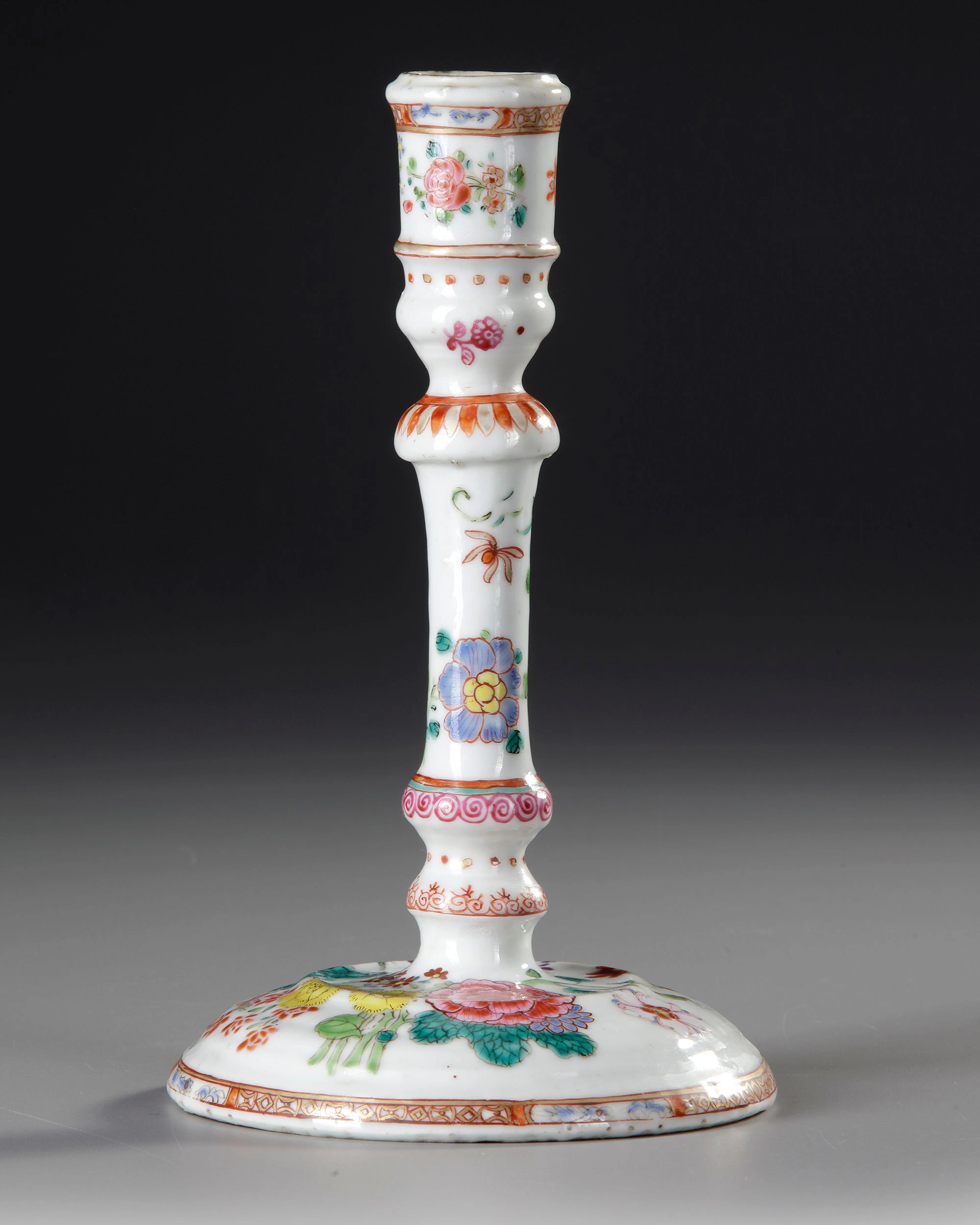 A CHINESE FAMILLE ROSE CANDLESTICK, 18TH CENTURY