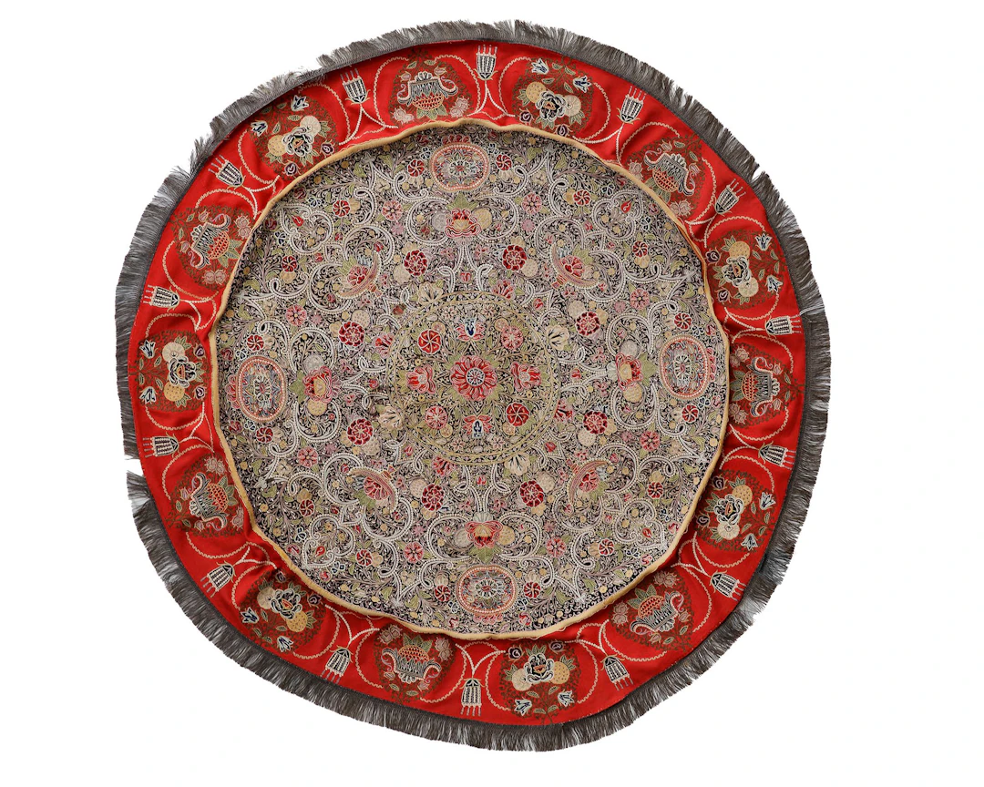 A RESHT EMBROIDERY CIRCULAR TABLE COVER, PERSIA, 19TH CENTURY