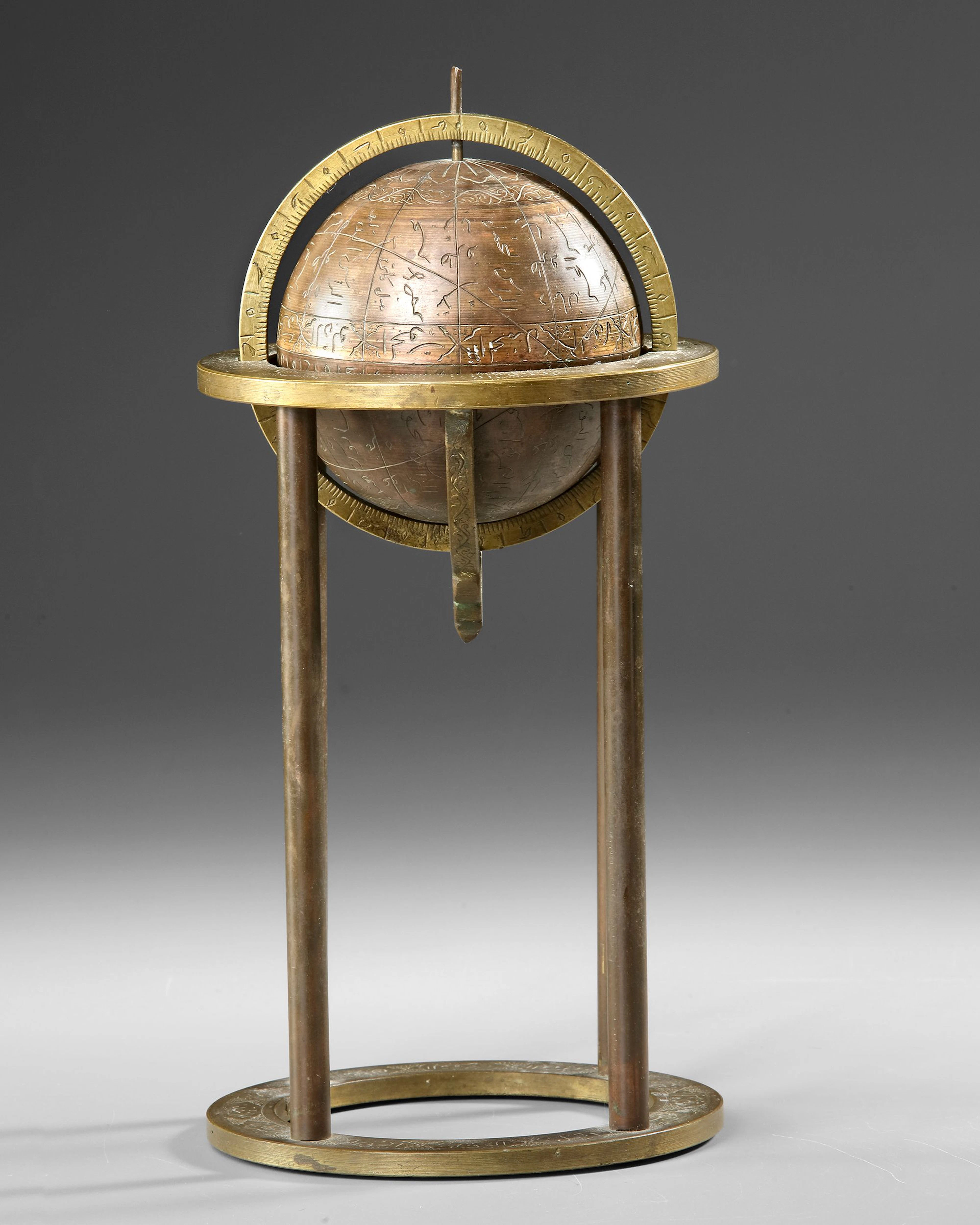 A PERSIAN ENGRAVED BRASS CELESTIAL GLOBE, 19TH CENTURY