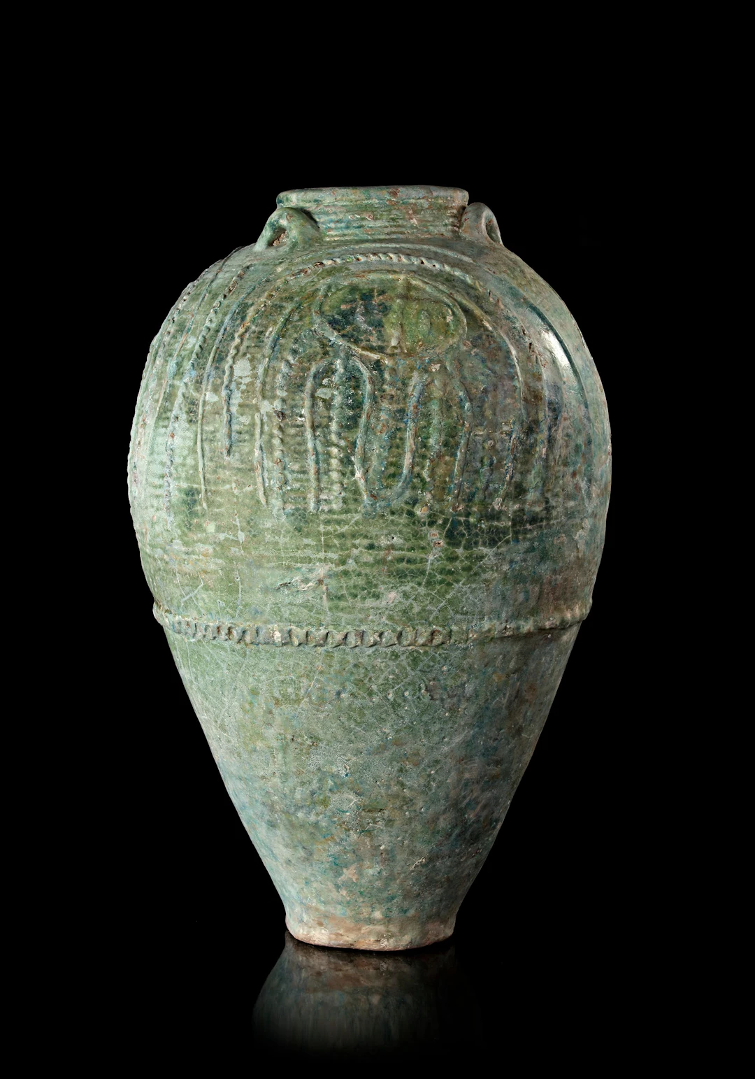 A LARGE UMAYYAD TURQUOISE-GREEN GLAZED JAR, MESOPOTAMIA, 7TH-8TH CENTURY