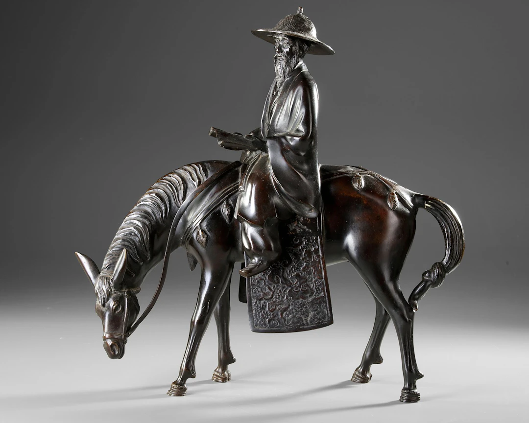 A CHINESE BRONZE FIGURE OF A SCHOLAR RIDING A DONKEY,19TH CENTURY