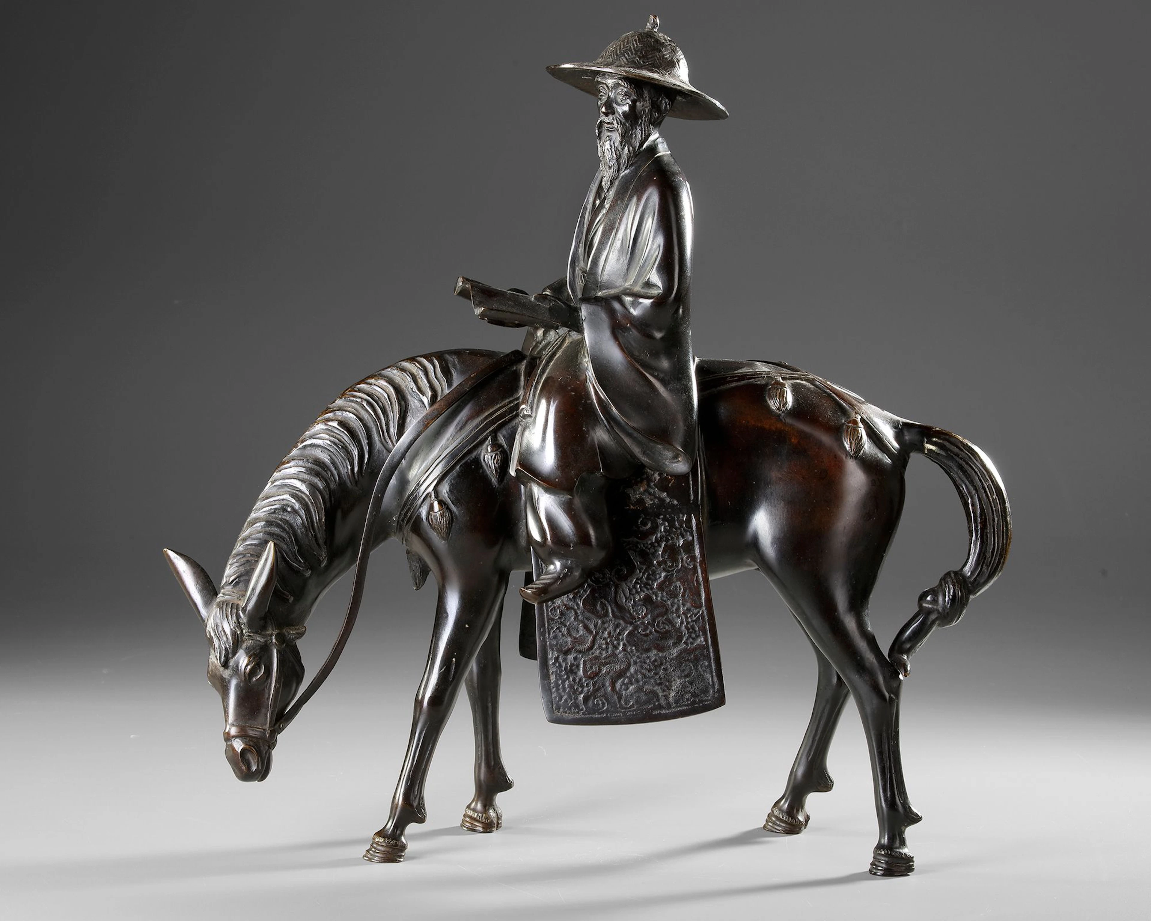 A CHINESE BRONZE FIGURE OF A SCHOLAR RIDING A DONKEY,19TH CENTURY