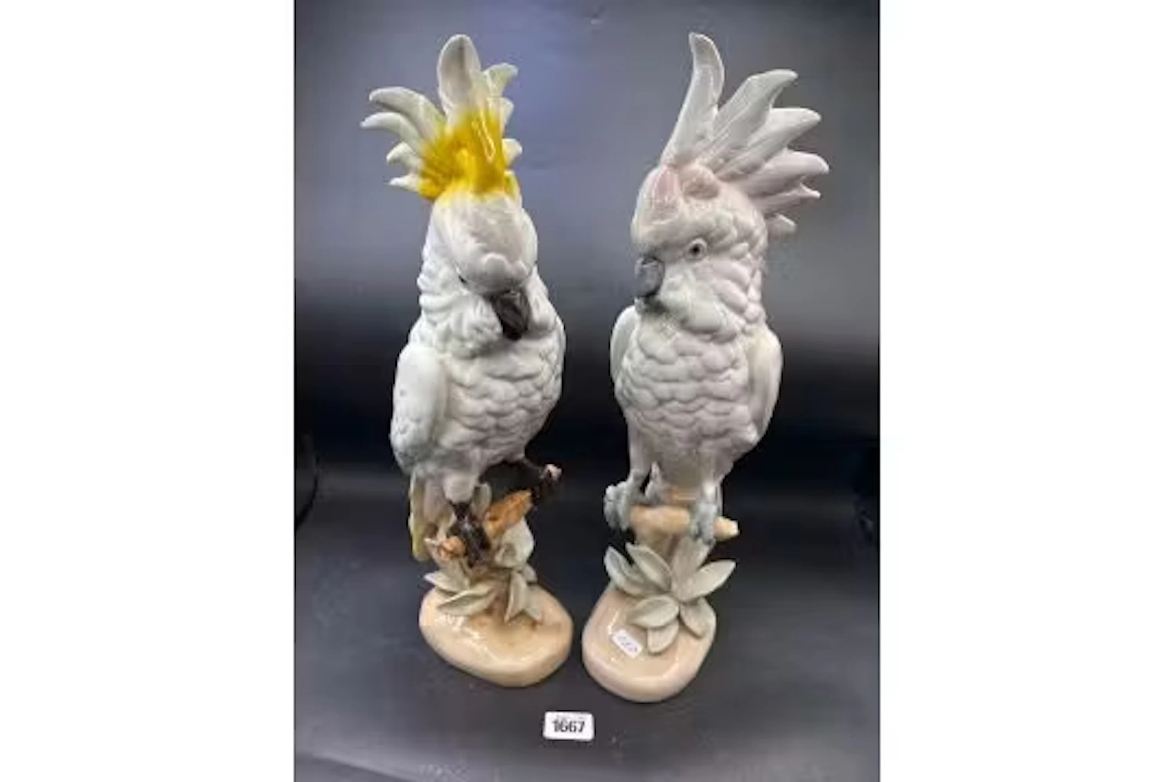 A large pair of Royal Dux figures of parakeets on branch, 16" high