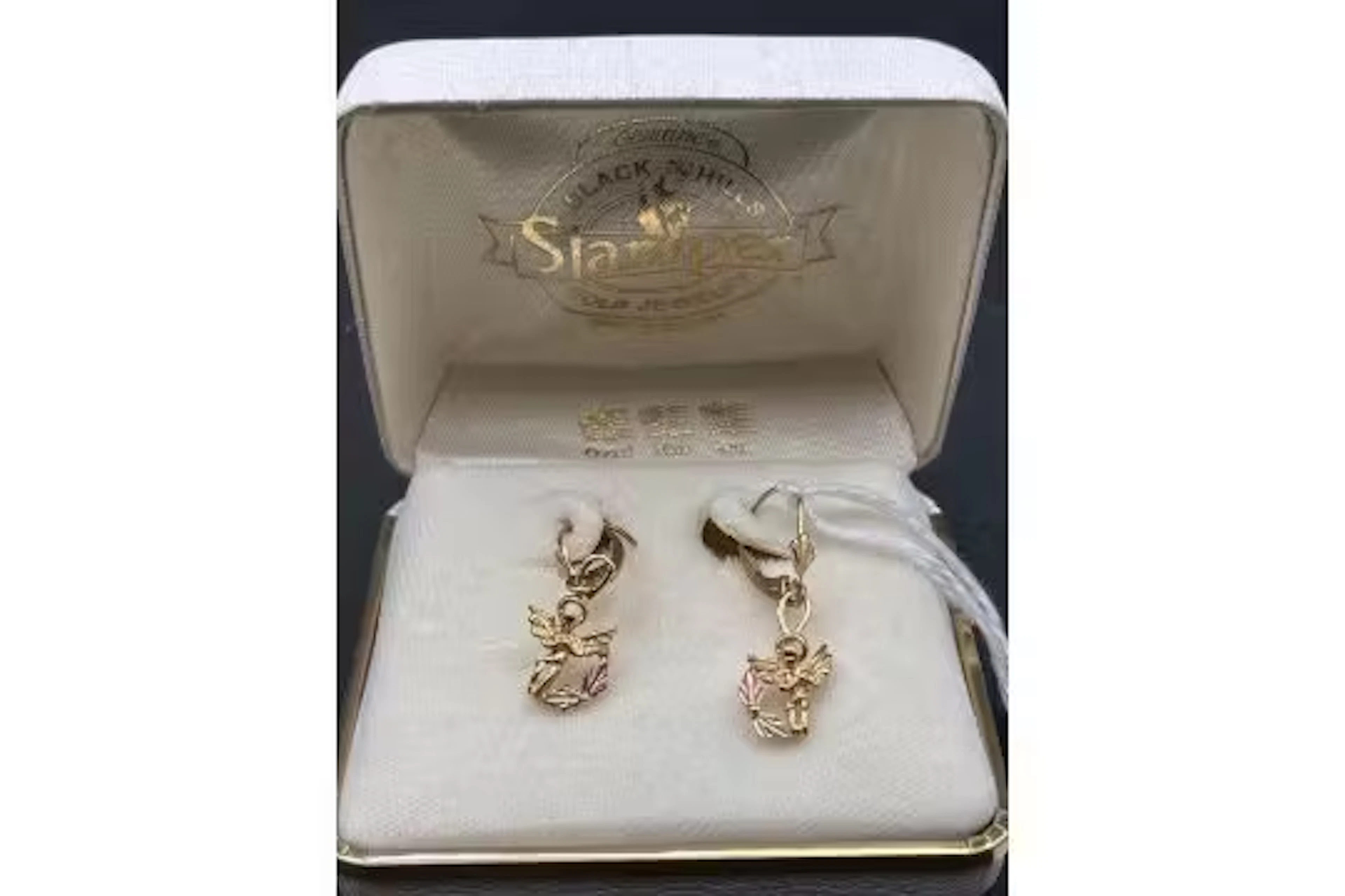 A pair of Tri colour lack hills drop earrings in the shape of an angel