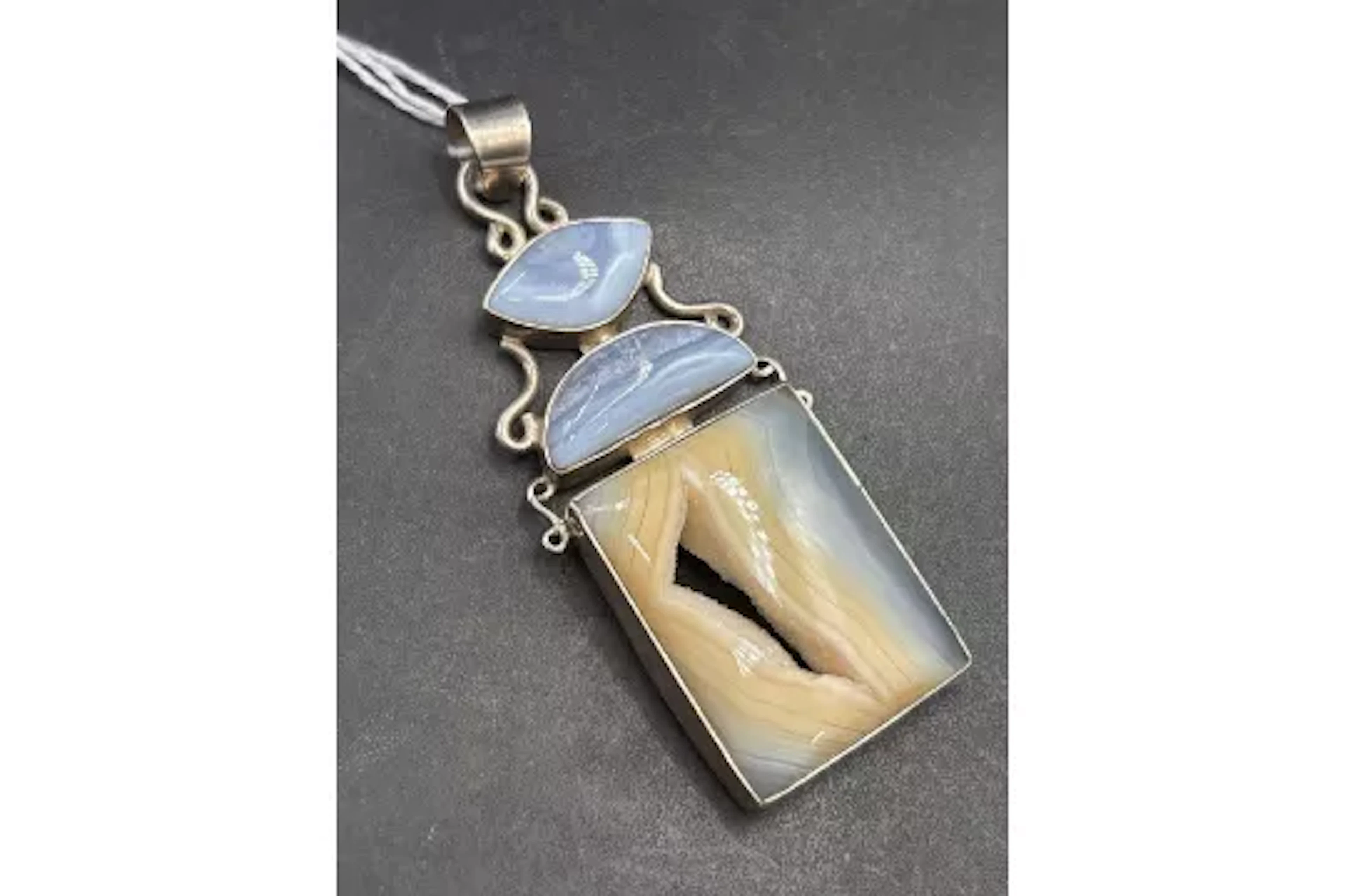 A silver hard stone fancy pendant 85mm drop