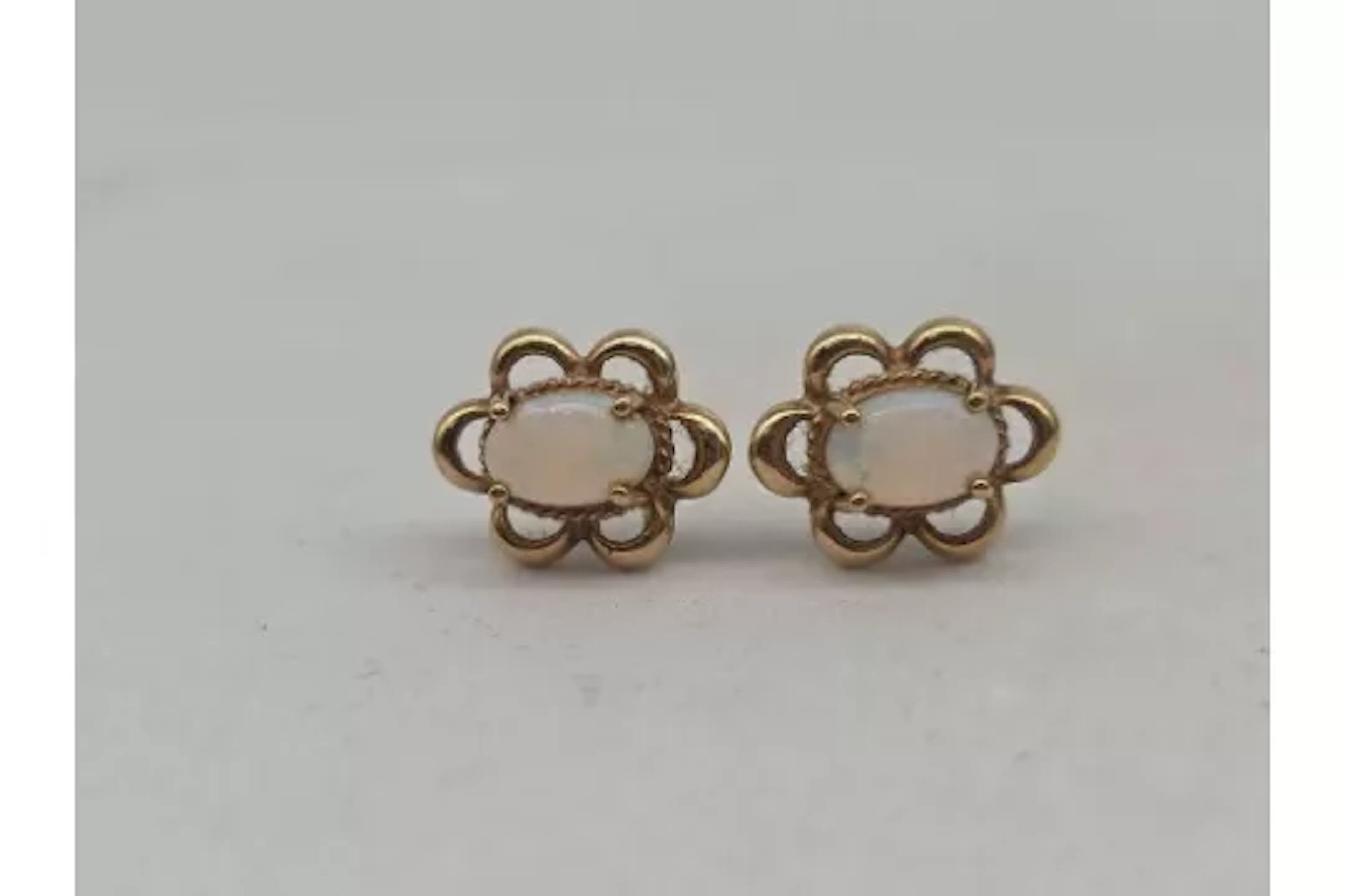 A pair of opal ear studs 9ct 1.2 gms