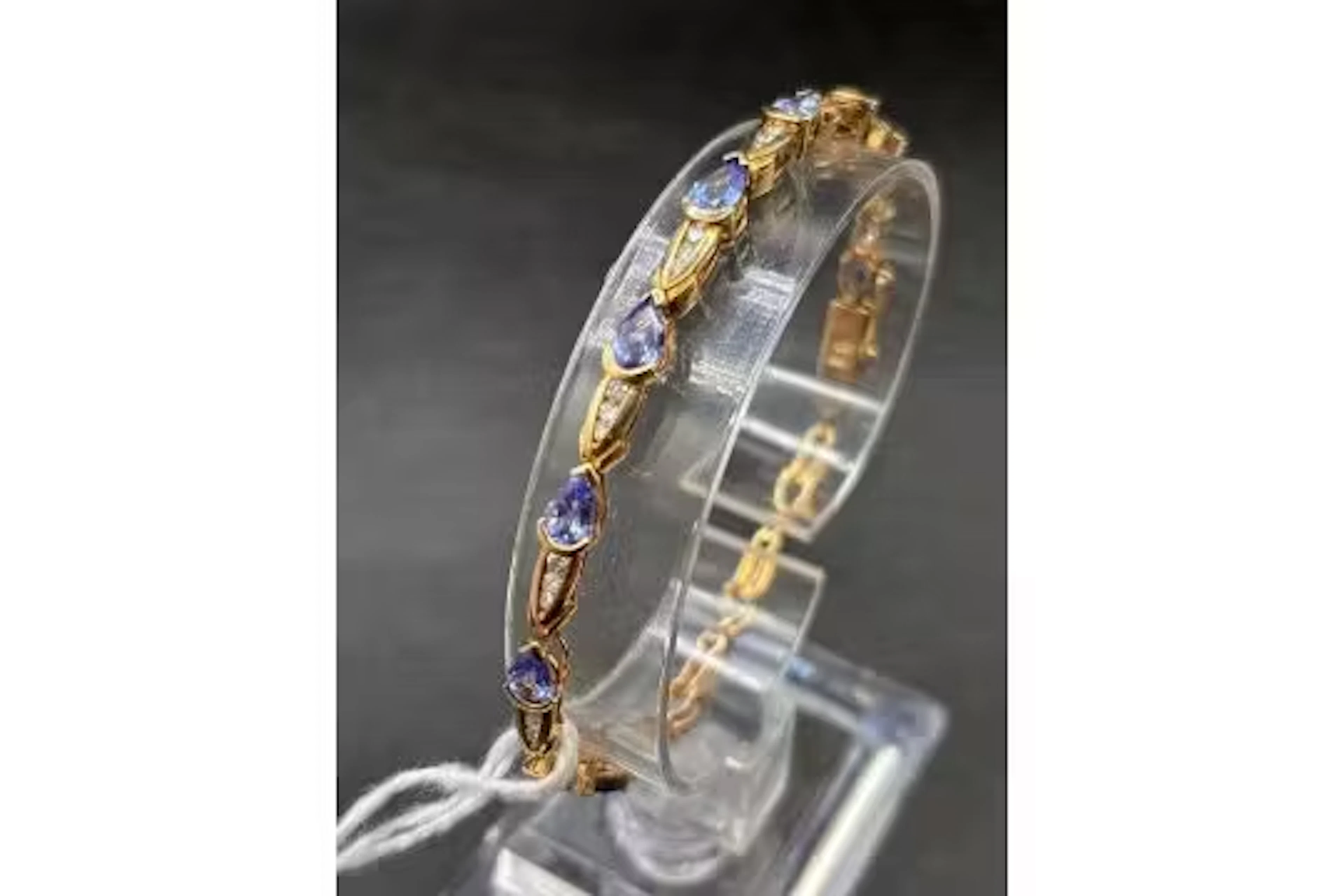 A 14ct gold and silver tanzanite bracelet 7.5 inch