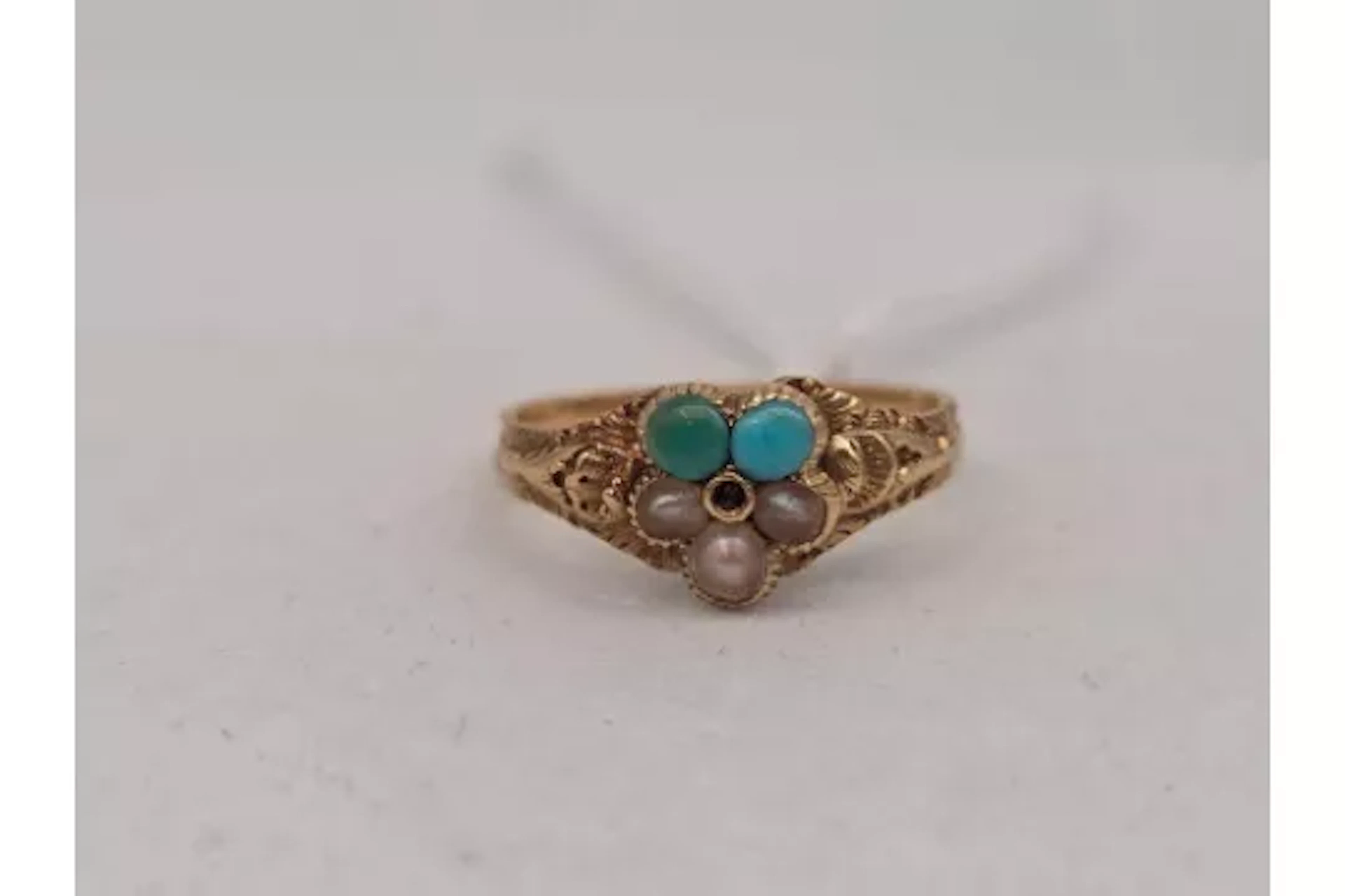 A Victorian turquoise and pearl ring 18ct gold size K 2.1 gms