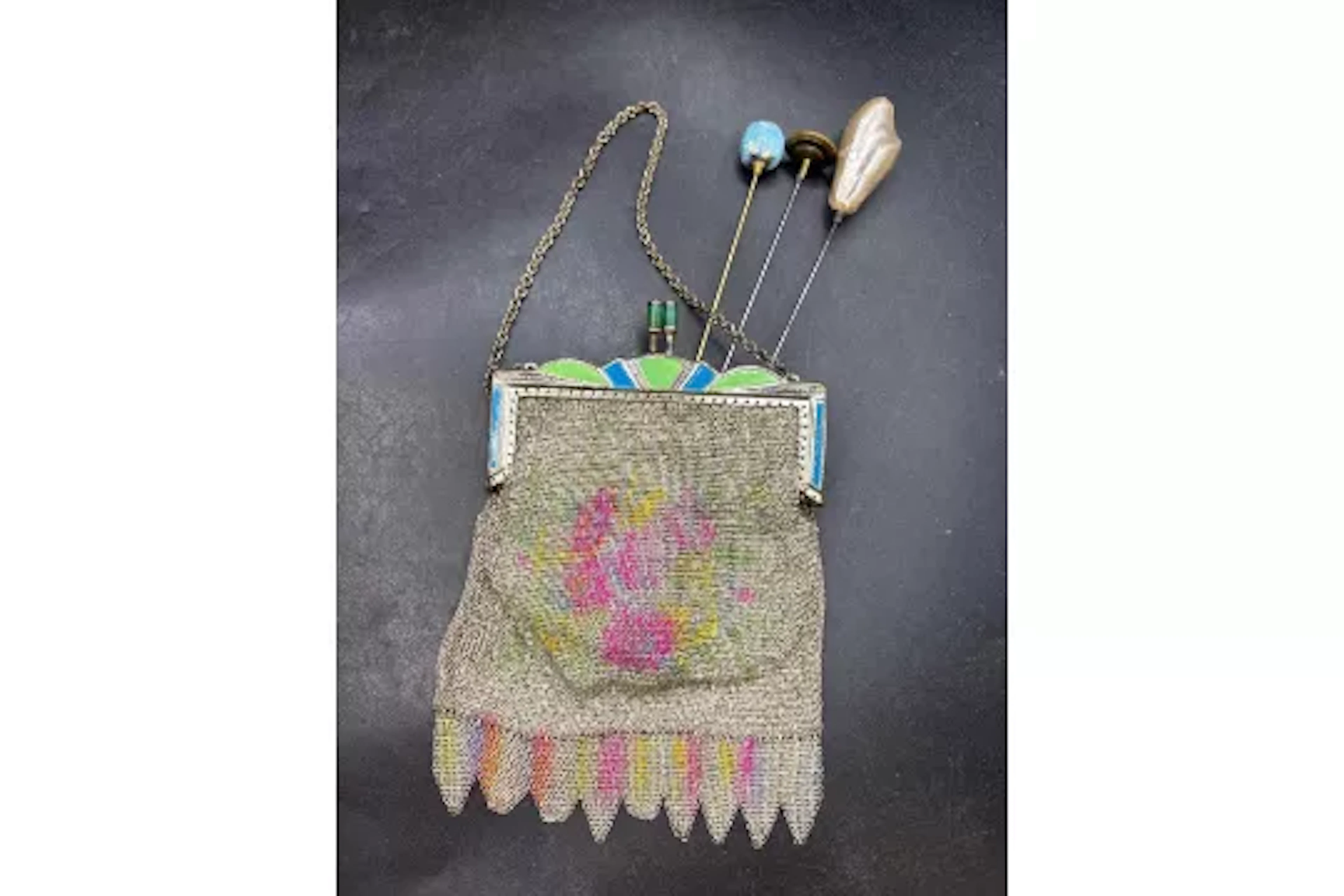 A art deco enamel mesh purse and three antique hat pins