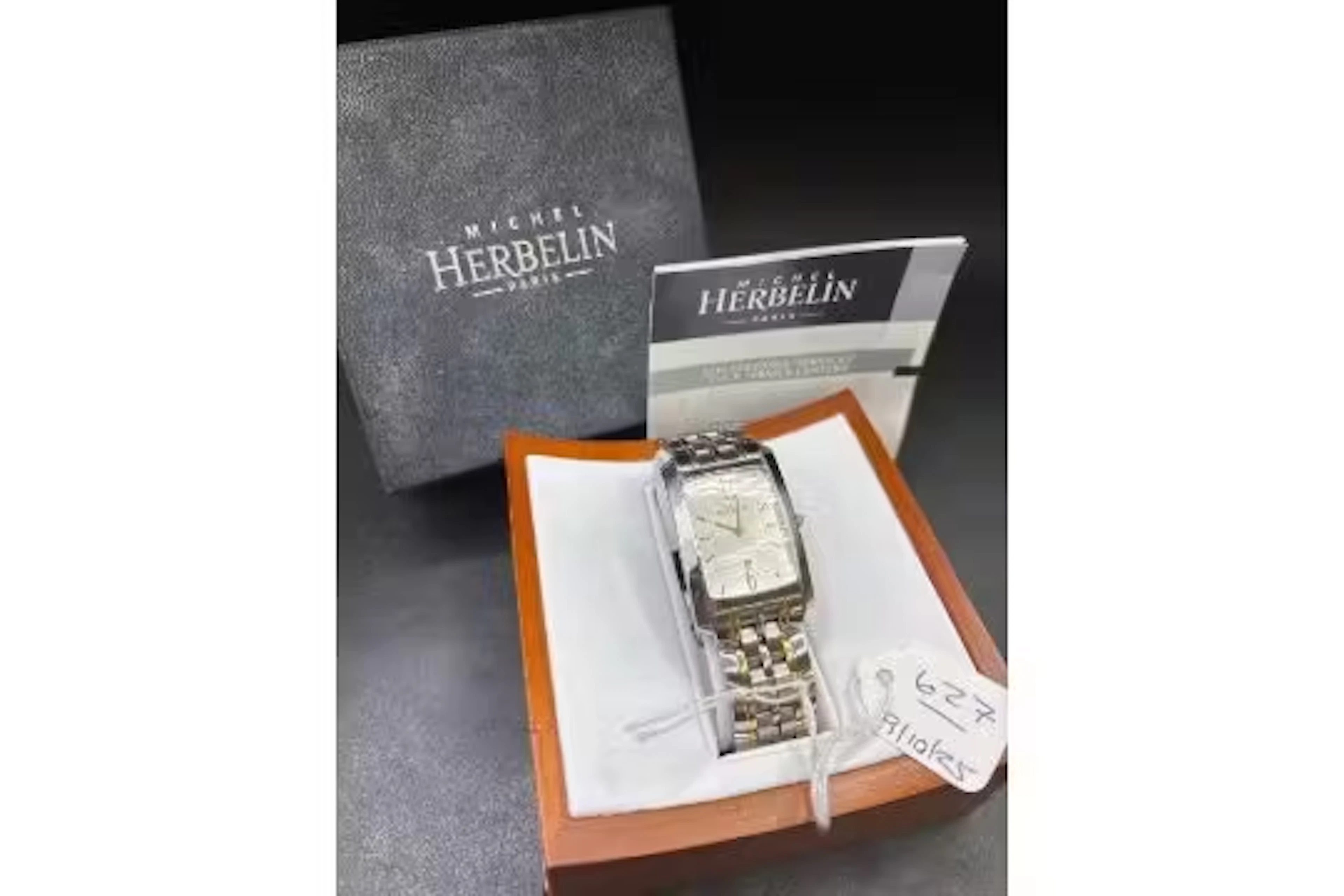 A MICHEL HERBELIN wrist watch with date aperture in case
