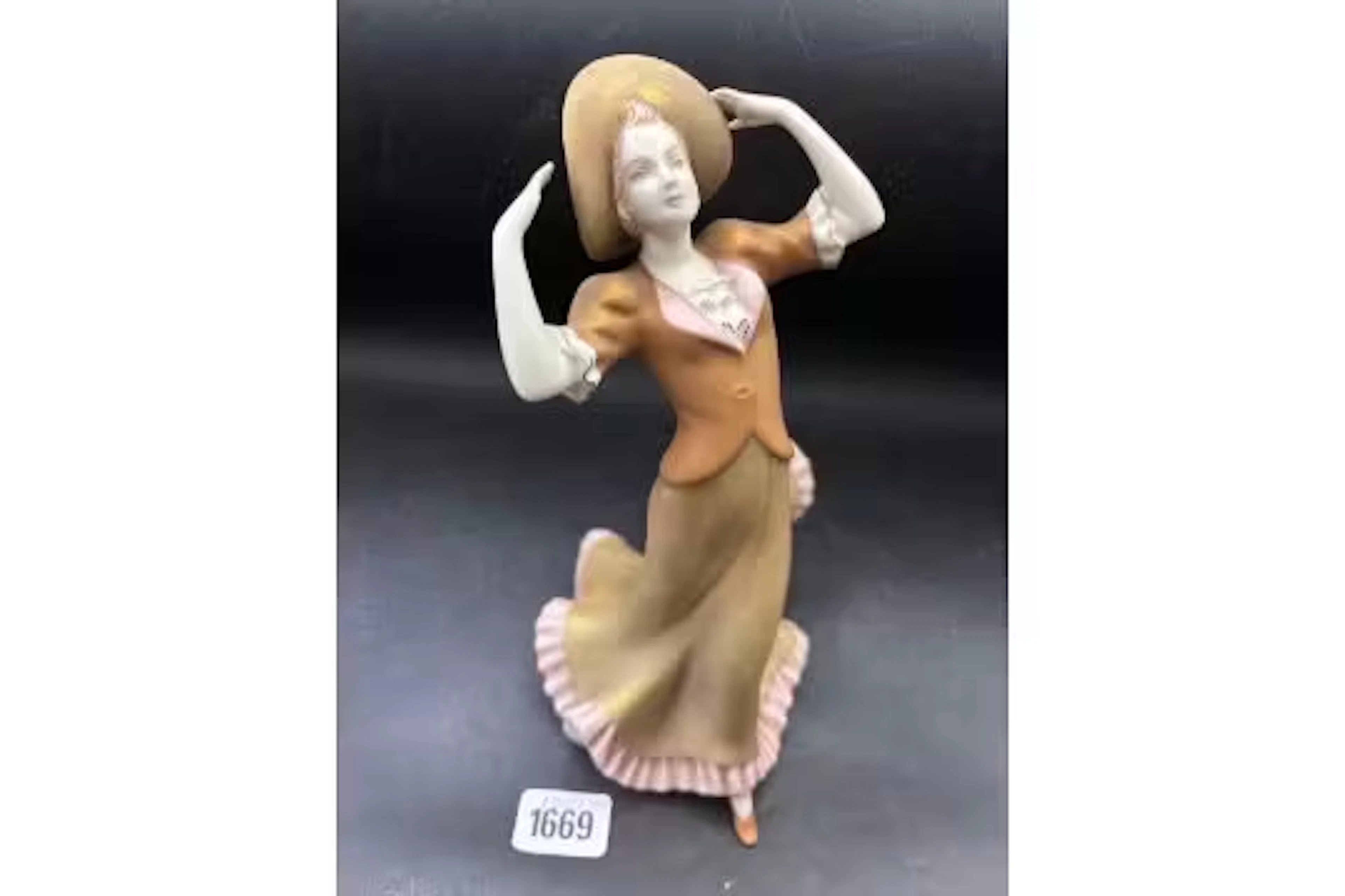 A Royal Dux figure of Lady in gold coloured gown, 8.5" high