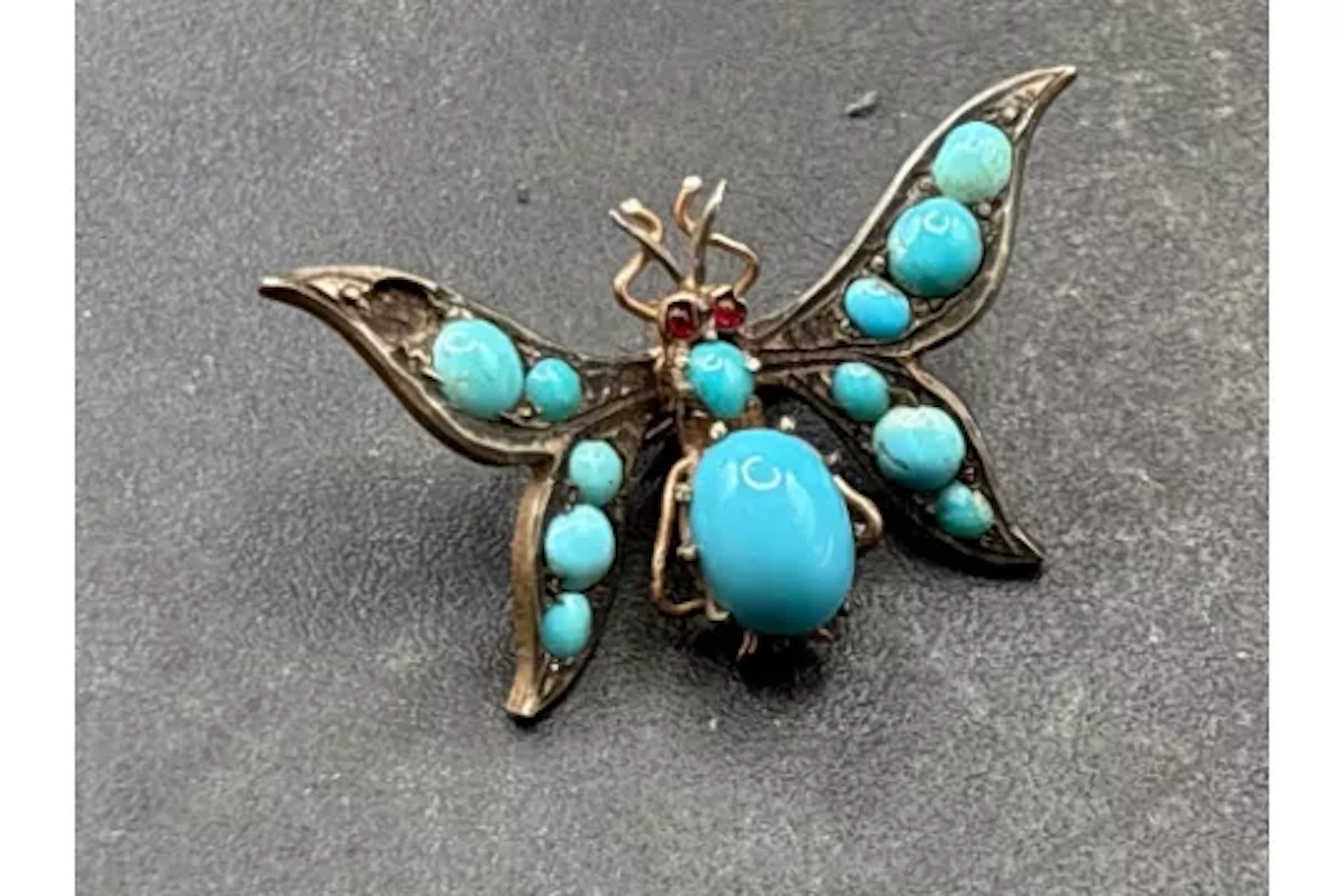 A turquoise butterfly clip in silver gilt