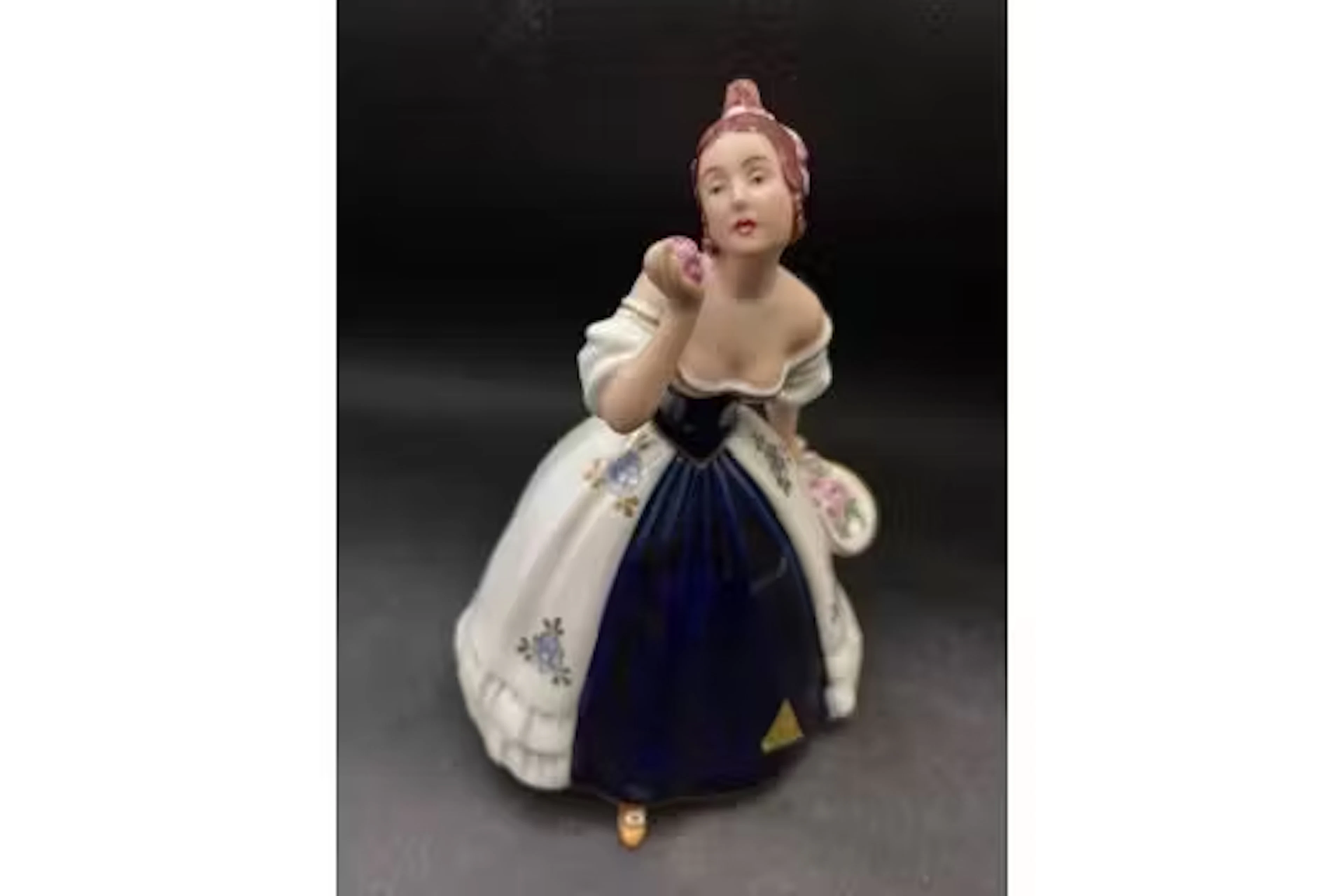 A Royal Dux figure of Lady in ball gown with label