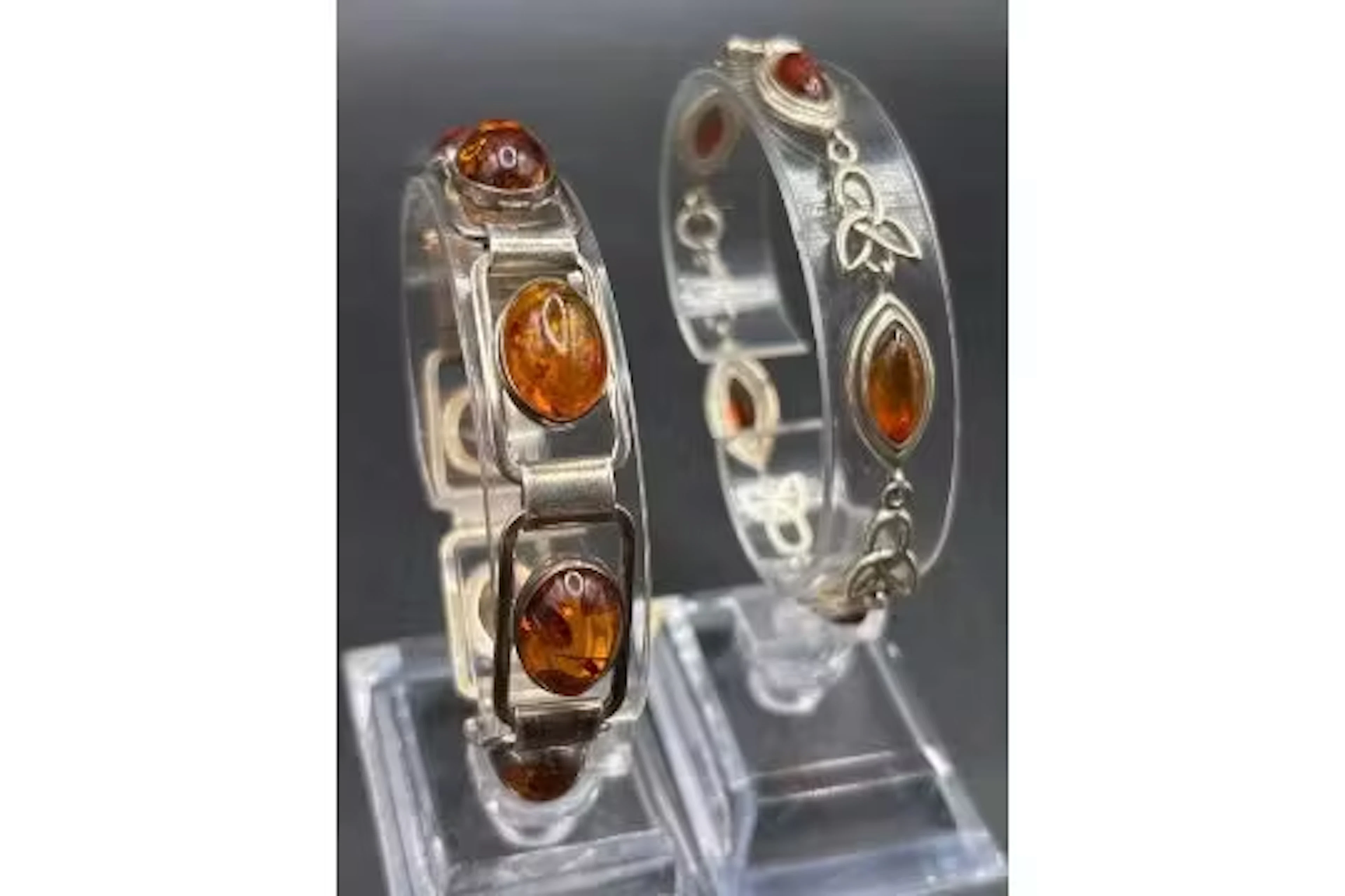 Two silver and amber bracelets both 7 inch