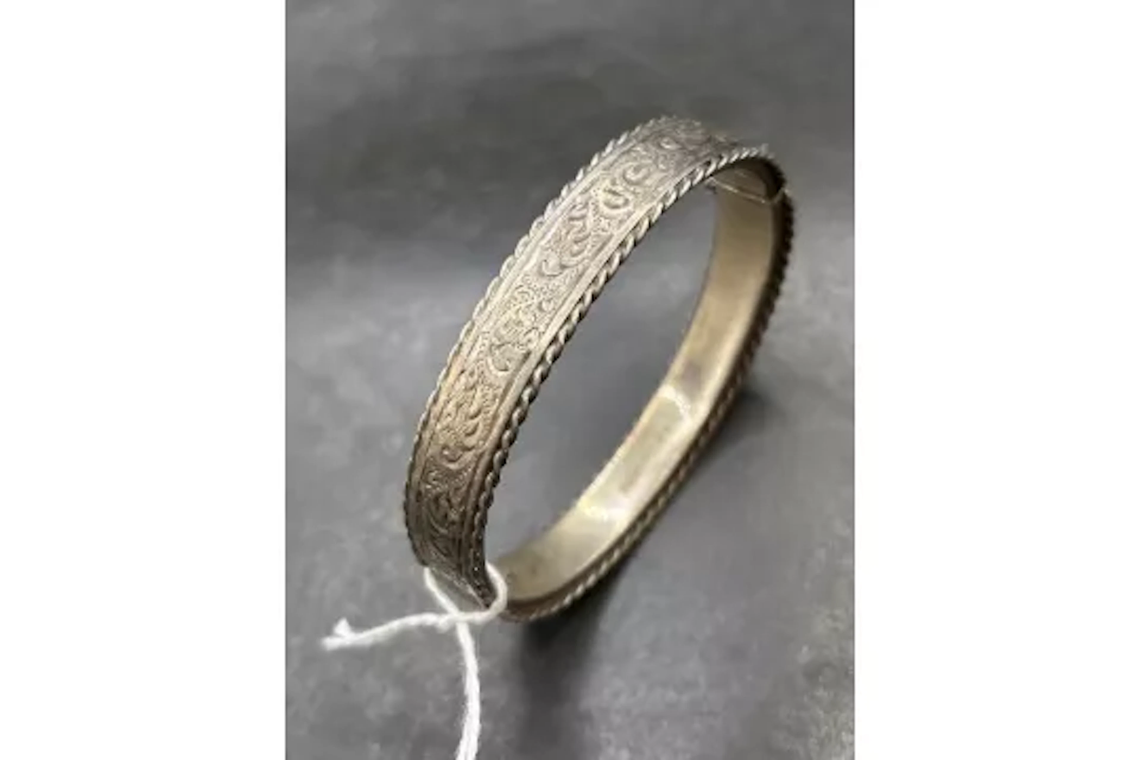 A hinged silver bangle 19 gms