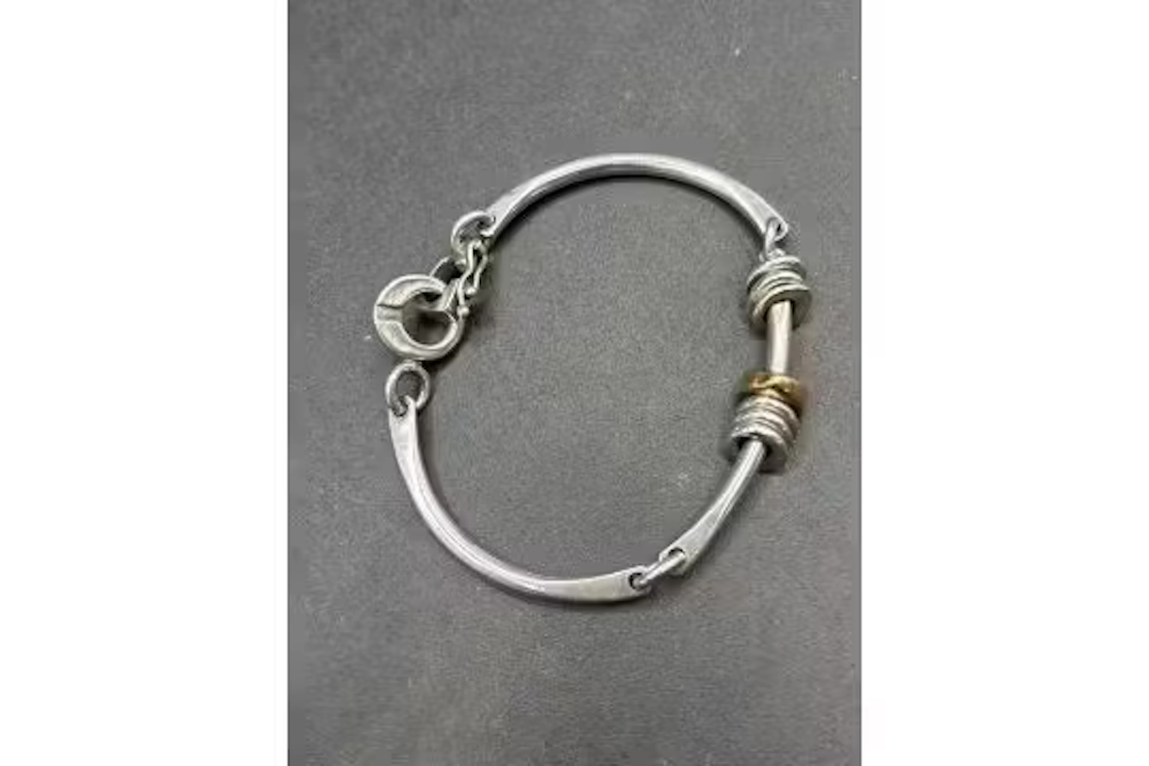 A silver bracelet with12ct gold accent bead 6.5 inches