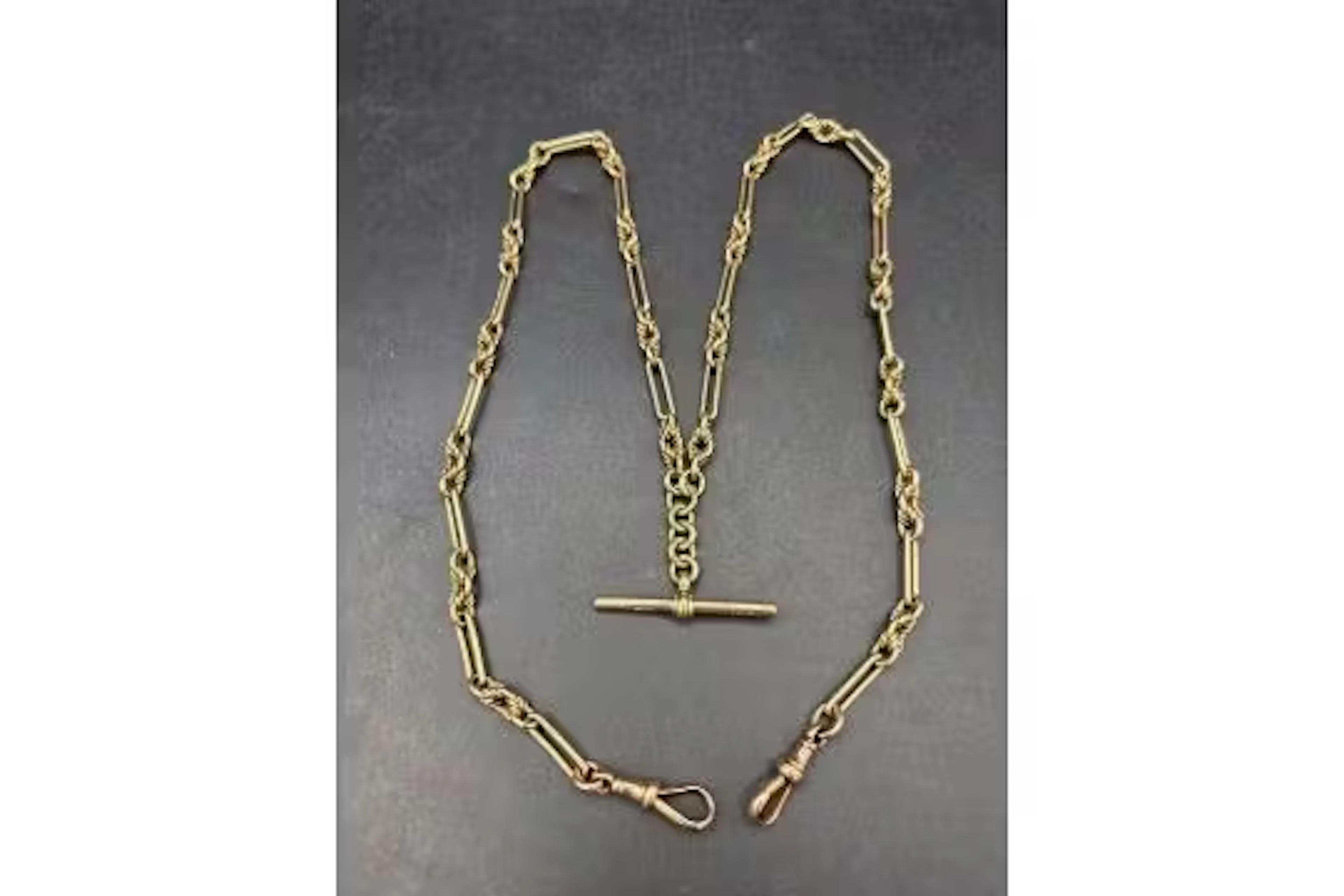 Antique 9ct gold fancy trombone and knot link Albert, 51.5g, length 25 inches