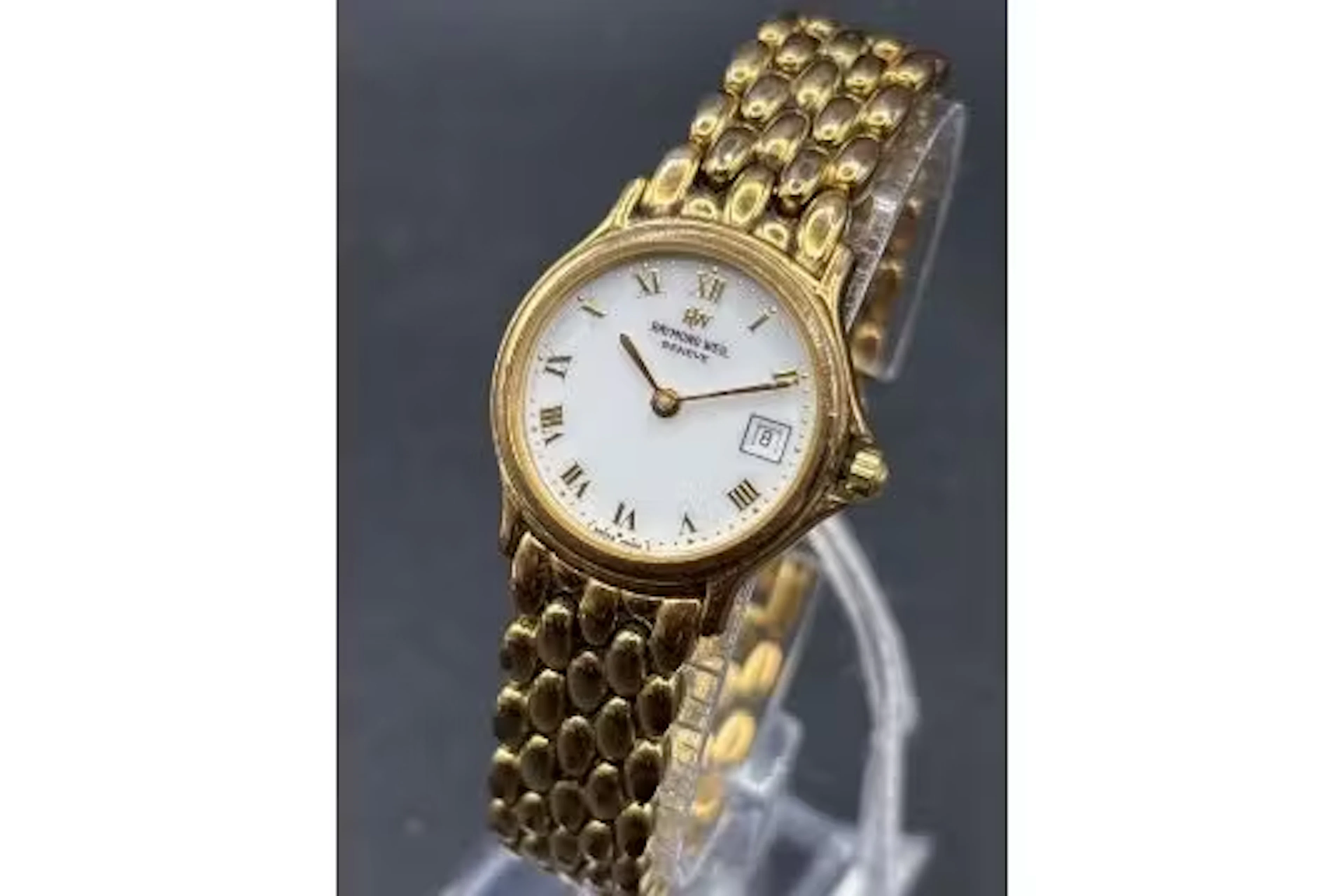 A ladies RAYMOND WEIL wrist watch with date aperture