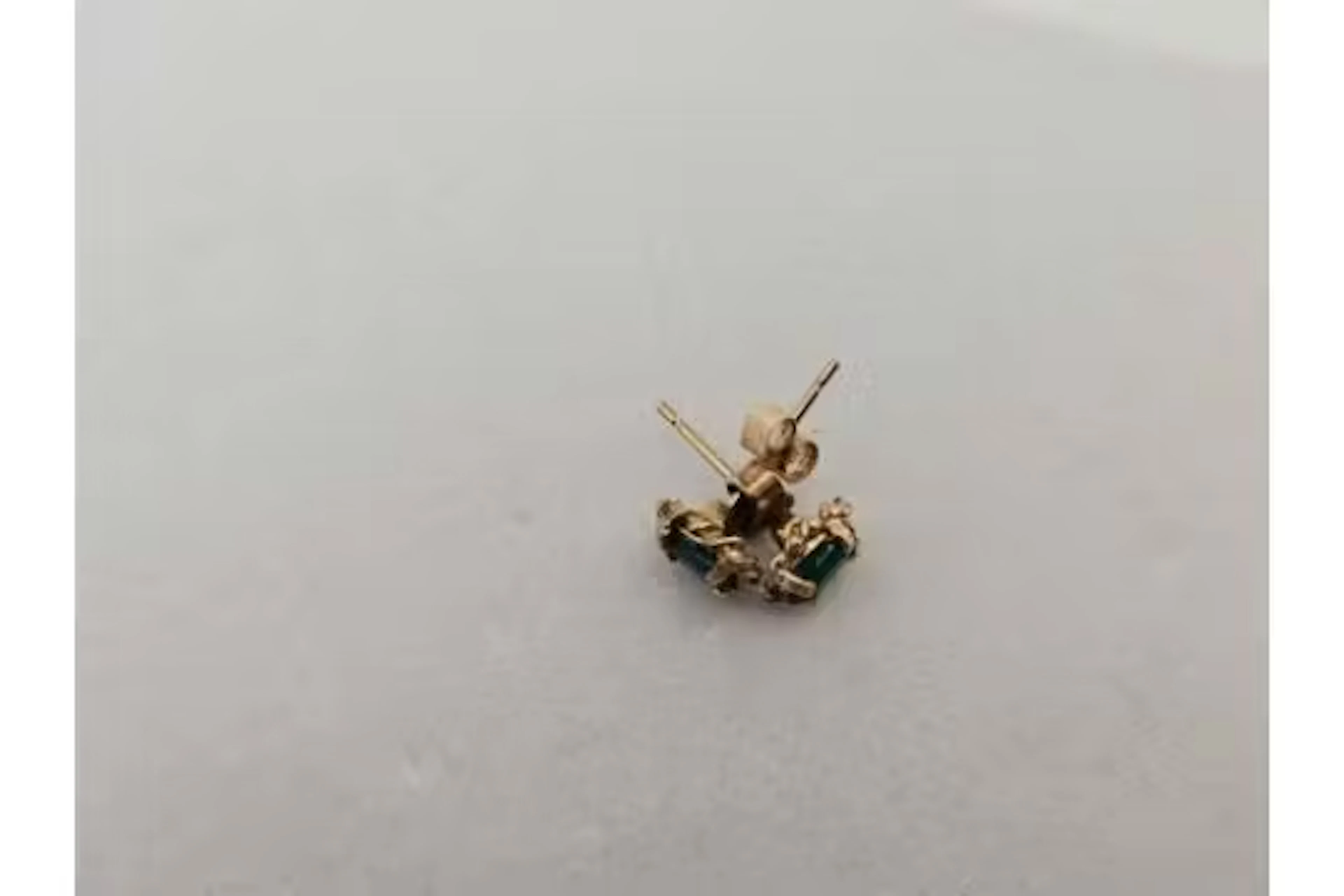 A pair of emerald ear studs 9ct