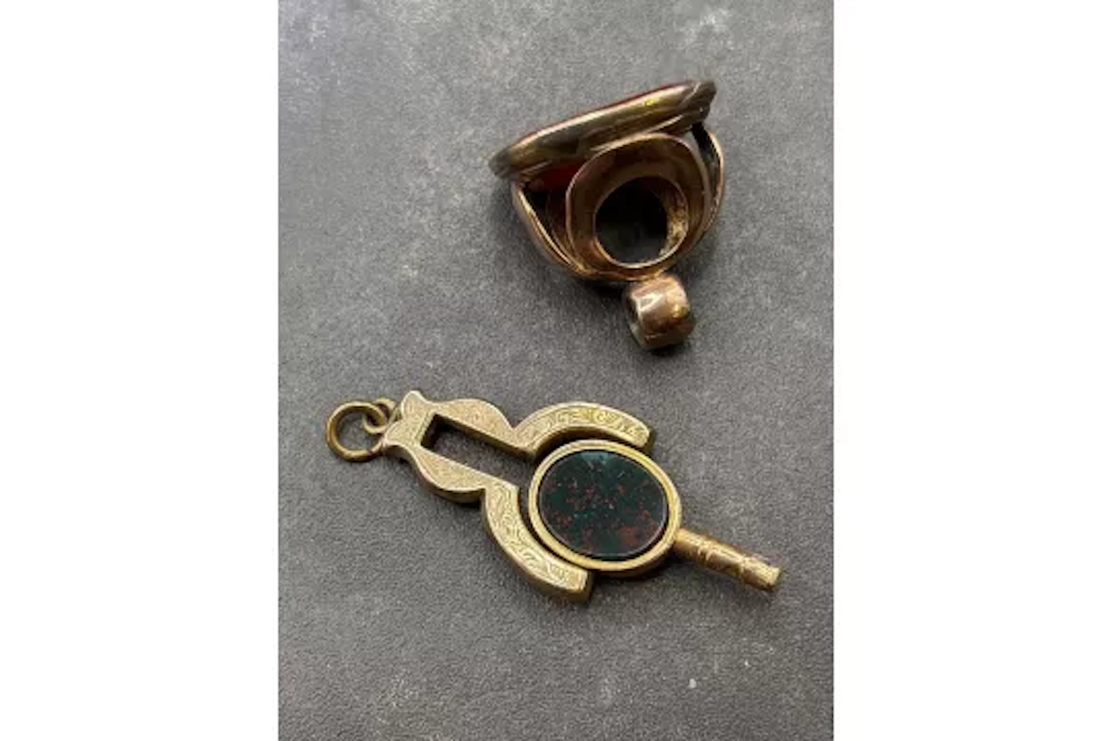 A antique had stone watch key together with a fob
