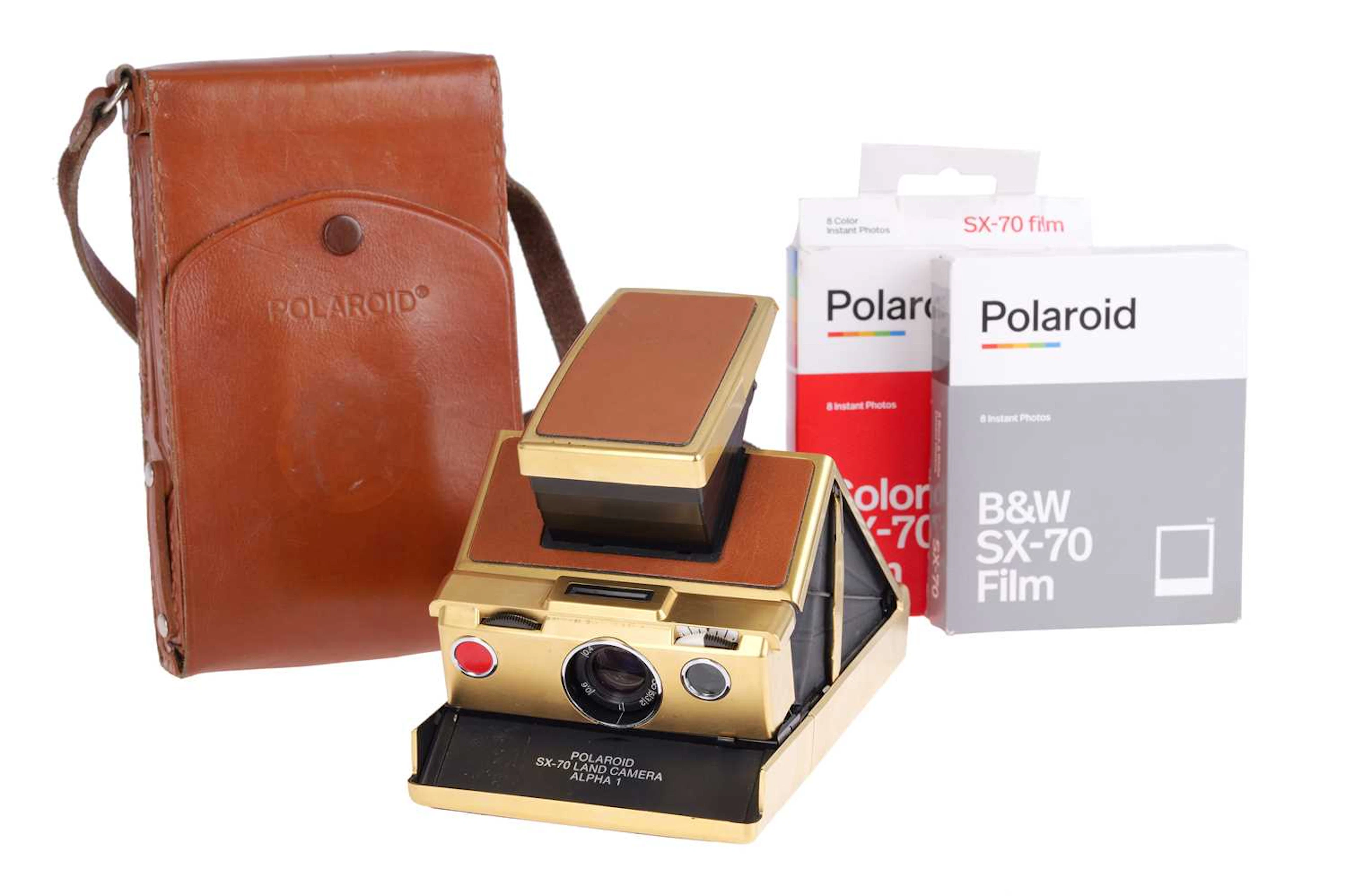 A Polaroid SX-70 Land Camera Alpha 1 Gold SLR Instant Camera