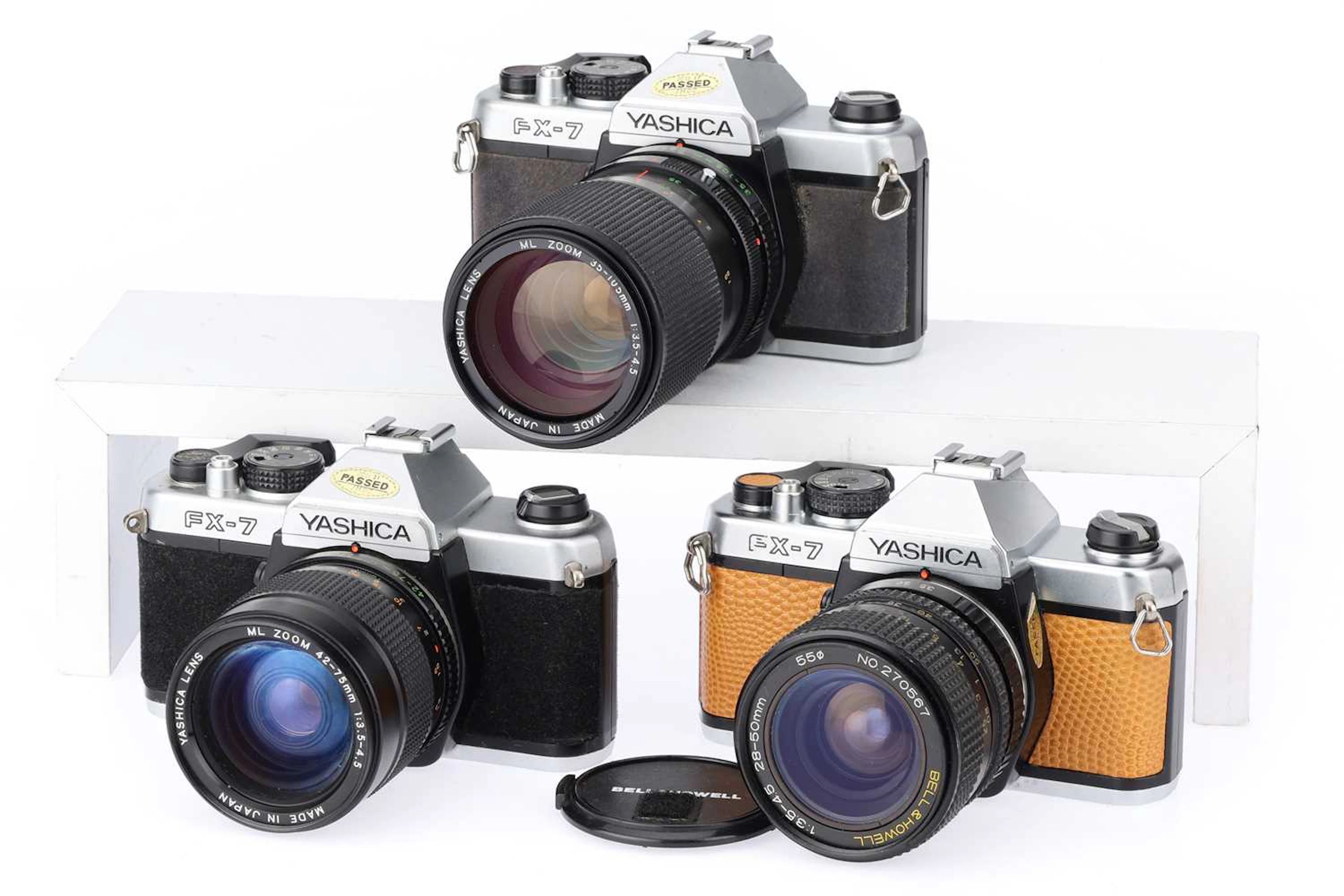 Three Yashica FX-7 35mm SLR Cameras