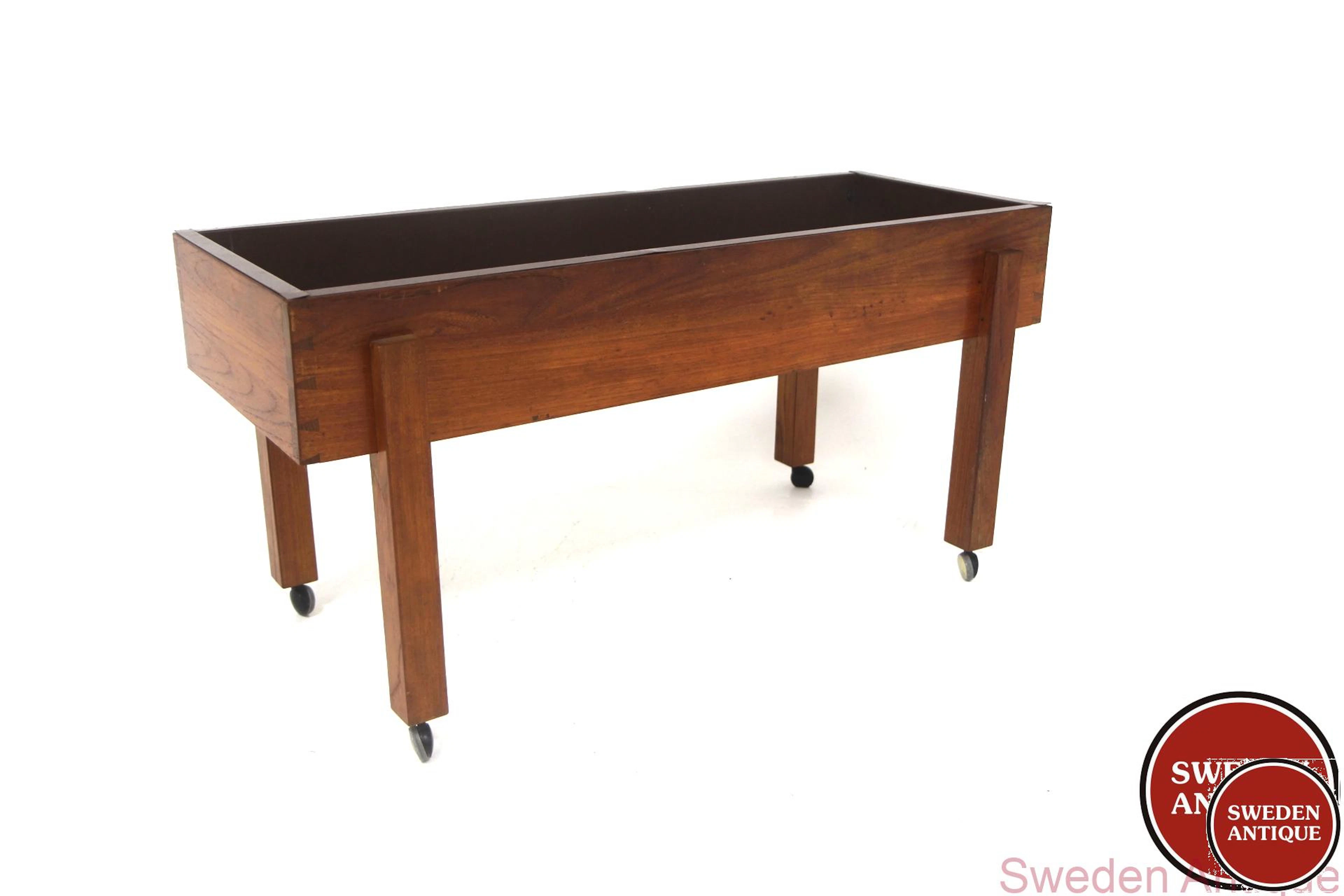 Flower stand Year: 1960s Origin: Swe. Material: Teak Metal W: 106cm