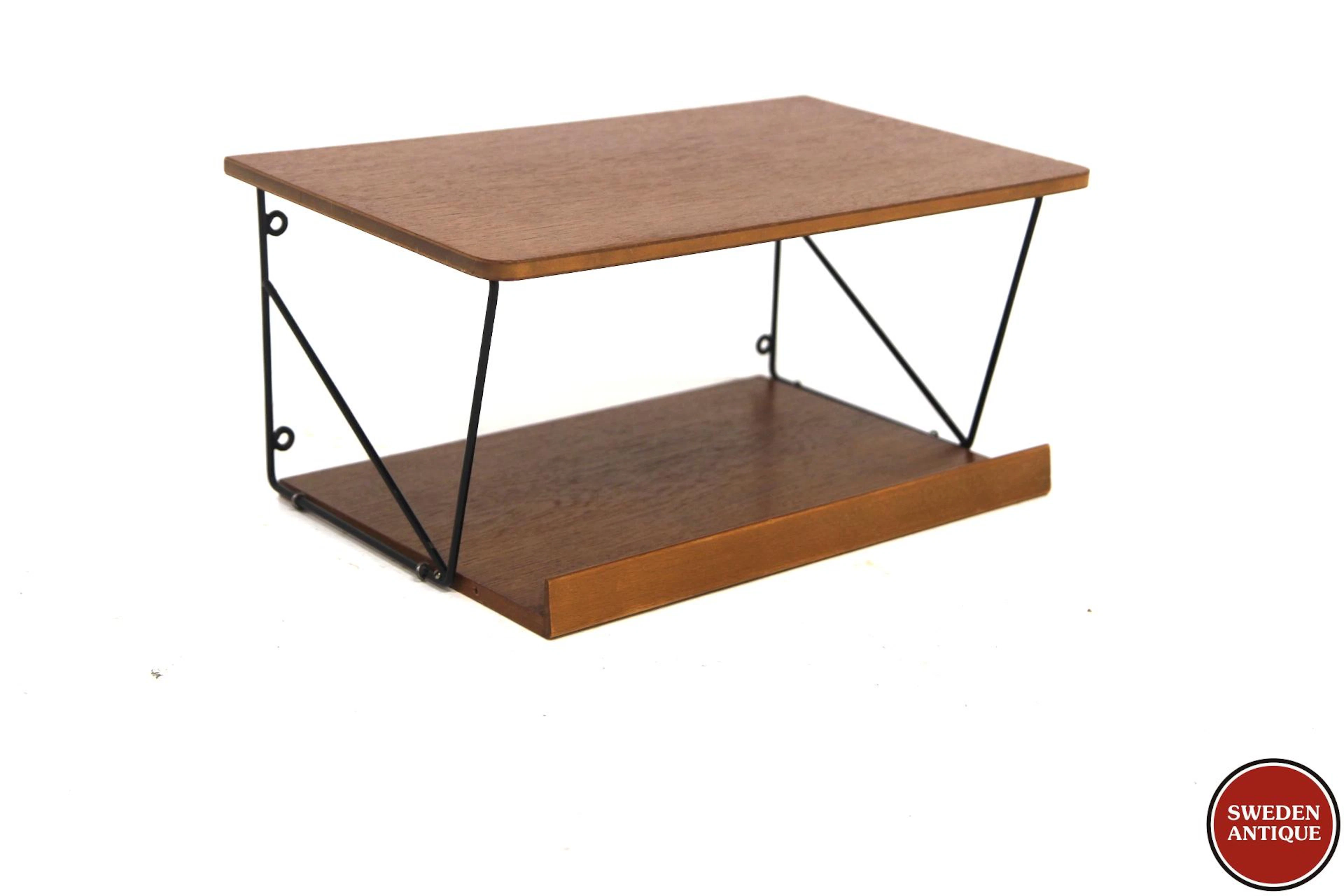 Wall shelf Year: 1950s Origin: Swe. Material: Teak Metal W: 44cm D: