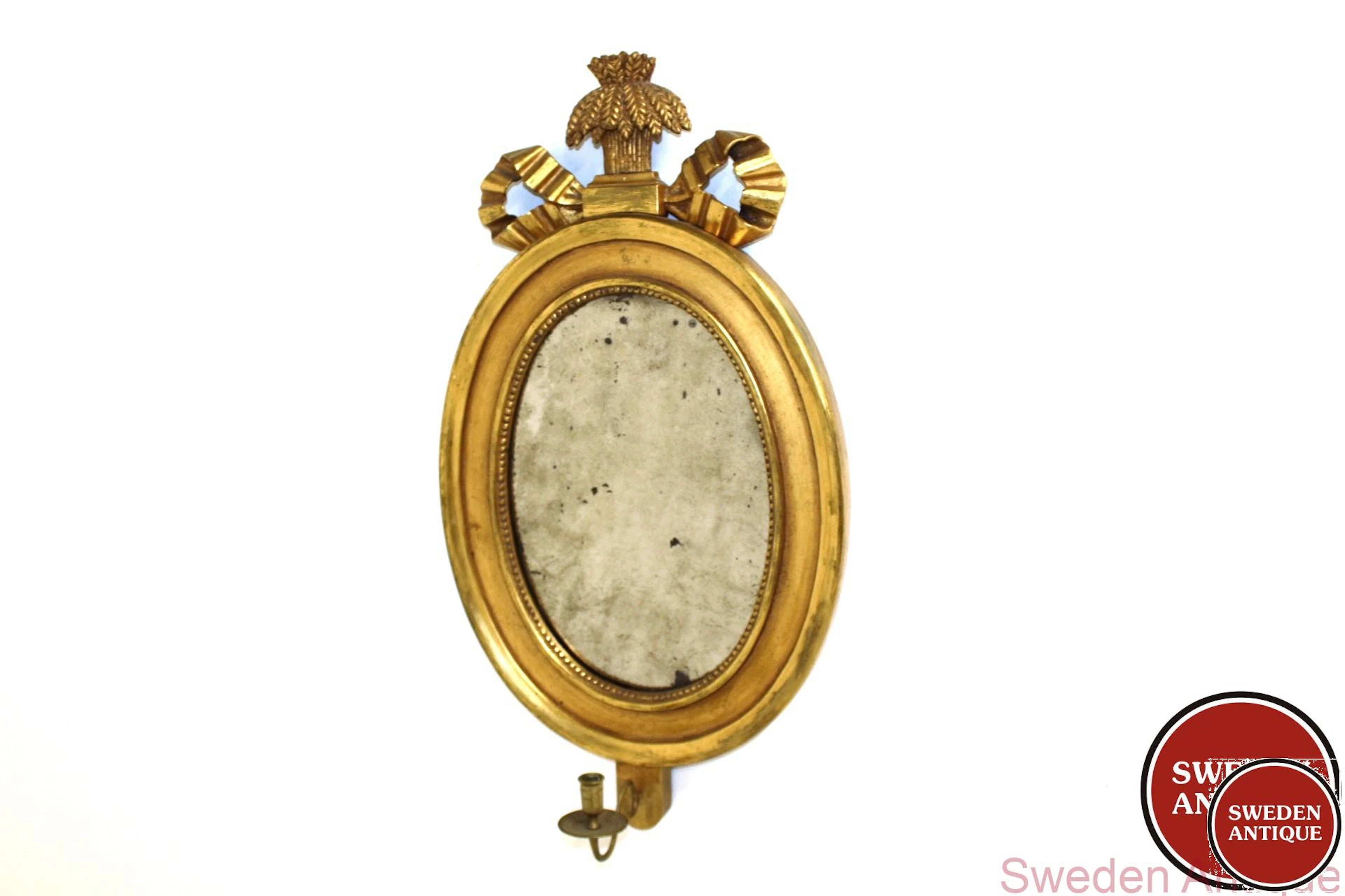 Antique Oval Mirror with candlestick holder. Gustavian Gilded and