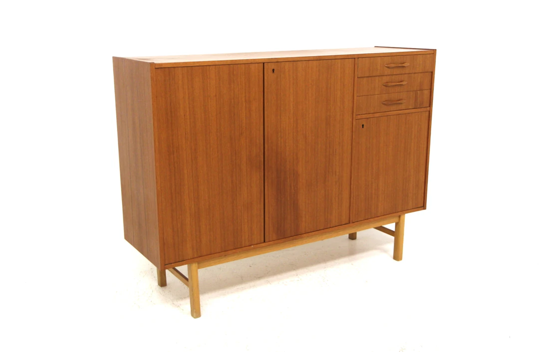 Sideboard Year: 1960s Origin: Swe. Material: Teak Oak W: 145cm D: 43cm H: 105cm