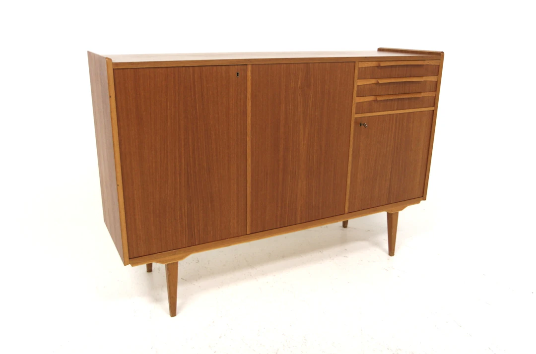Sideboard / Highboard Year: 1960s Origin: Swe. Material: Teak Oak