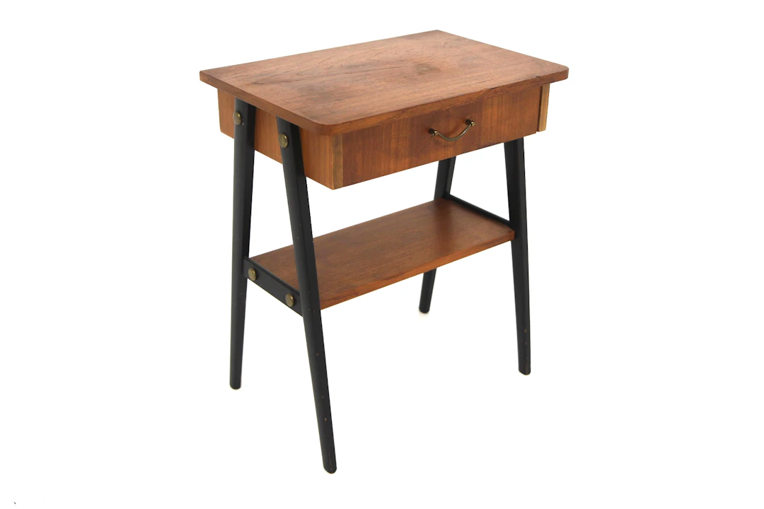 Bedside table Year: 1950s Origin: Swe. Material: Teak Black Metal