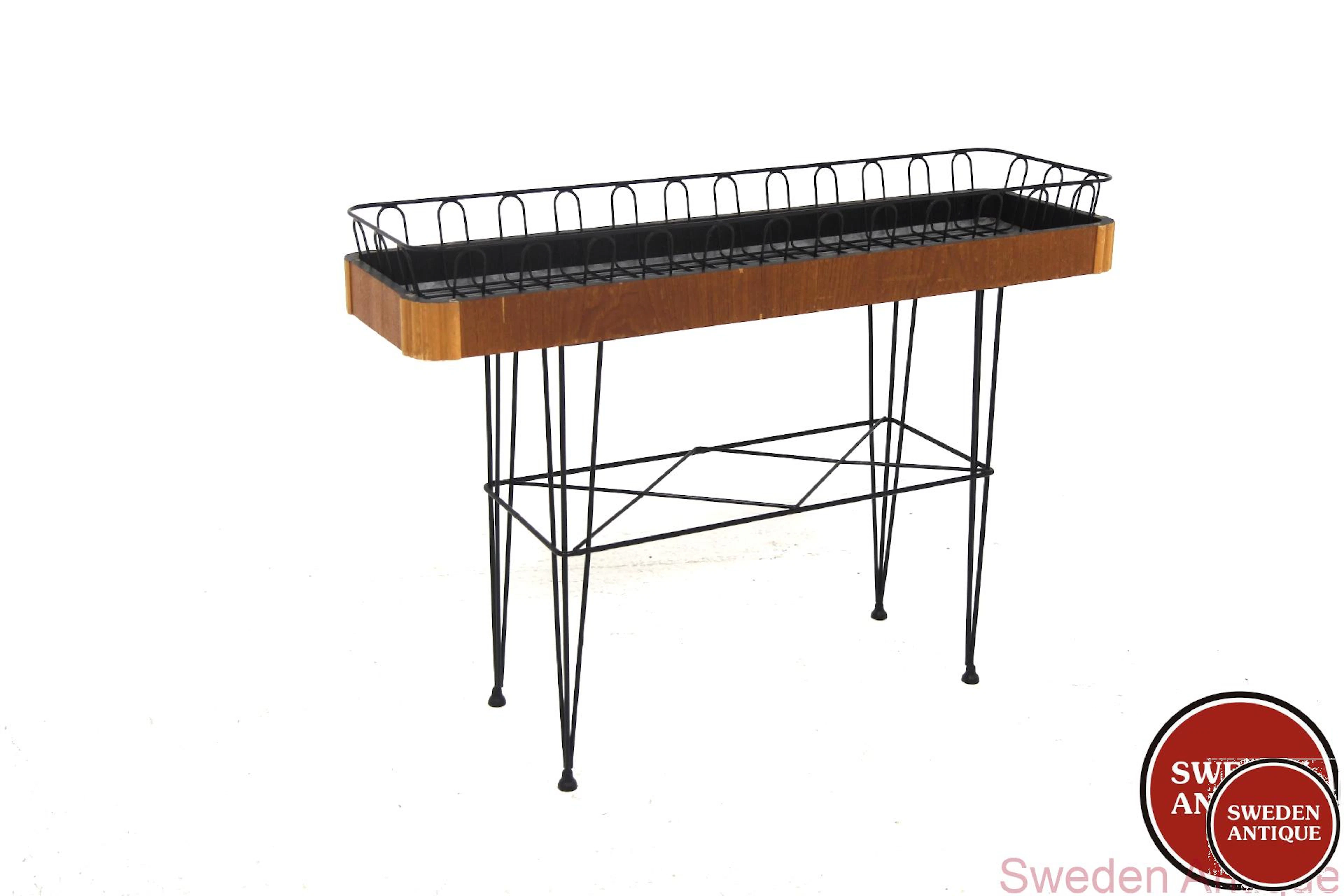 Flower stand Year: 1950s Origin: Swe. Material: Teak Metal W: 86cm