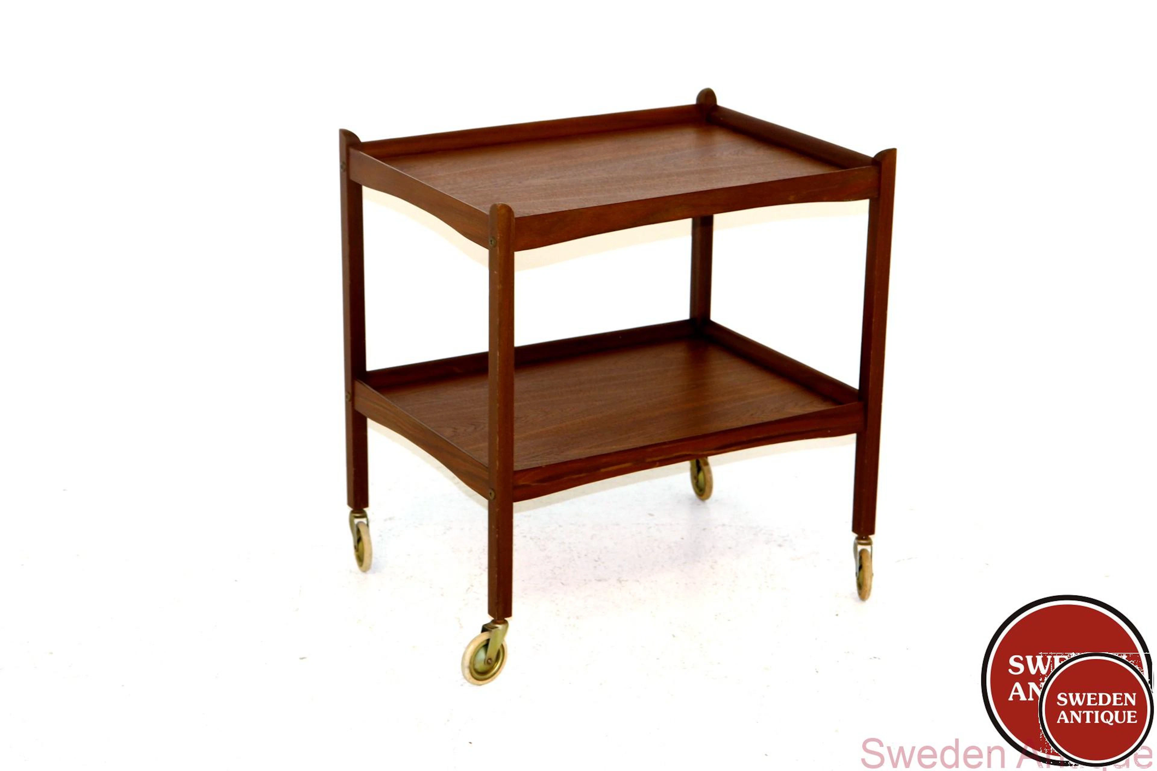 Trolley / serving cart Year: 1960s Origin: Swe. Material: Teak W: