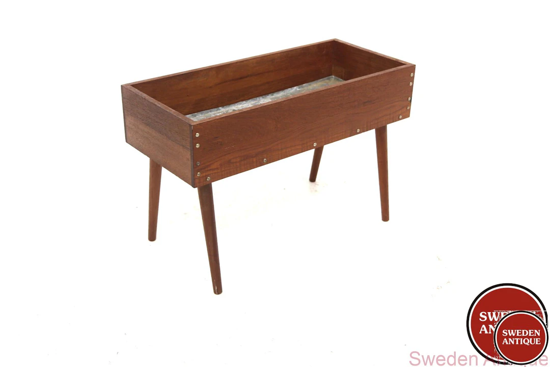 Flower stand Year: 1950s Origin: Swe. Material: Teak Metal W: 69cm