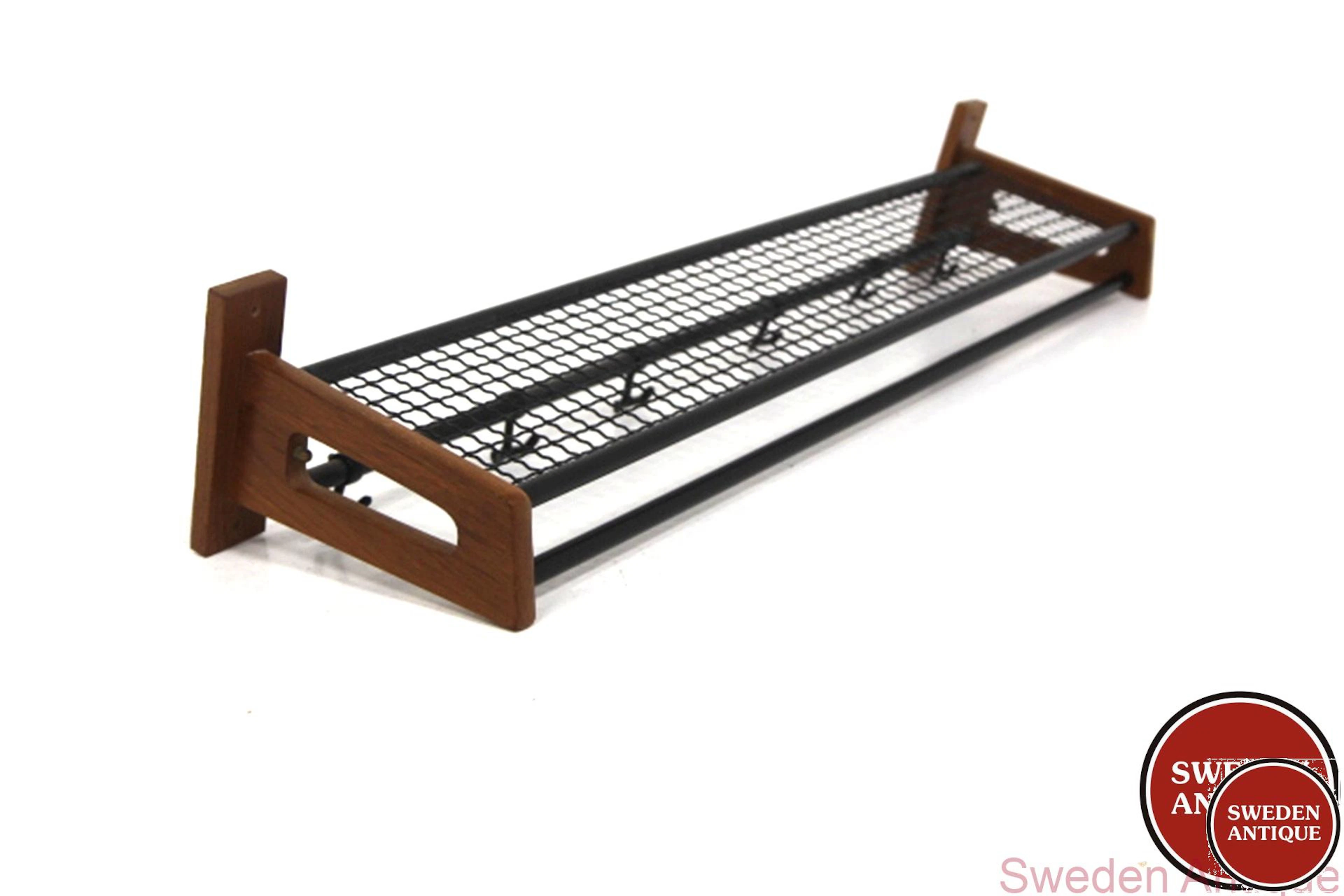 Coat hanger Year: 1960s Origin: Swe. Material: Teak Metal Plastic