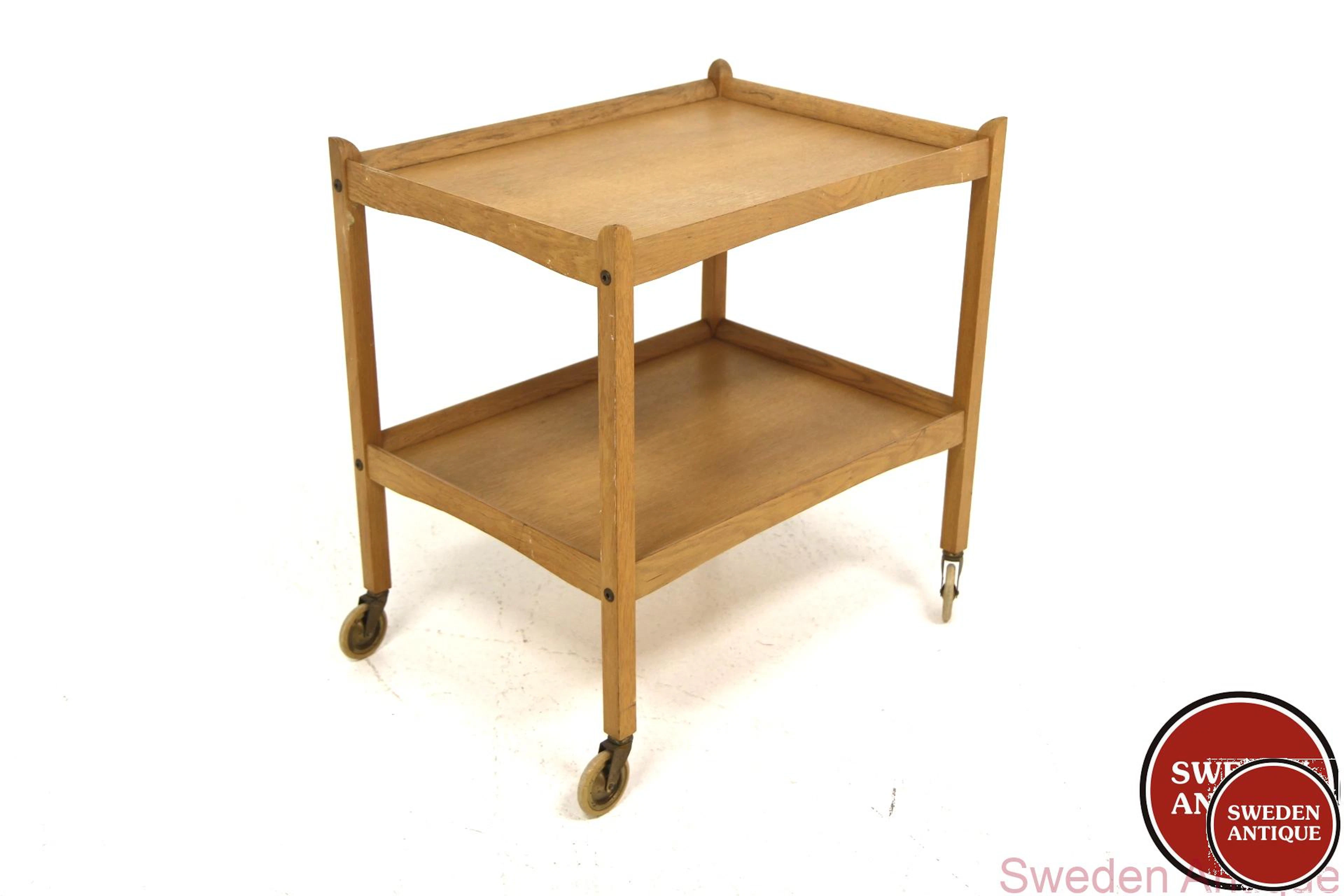 Trolley / serving cart Year: 1960s Origin: Swe. Material: Oak W: 64cm