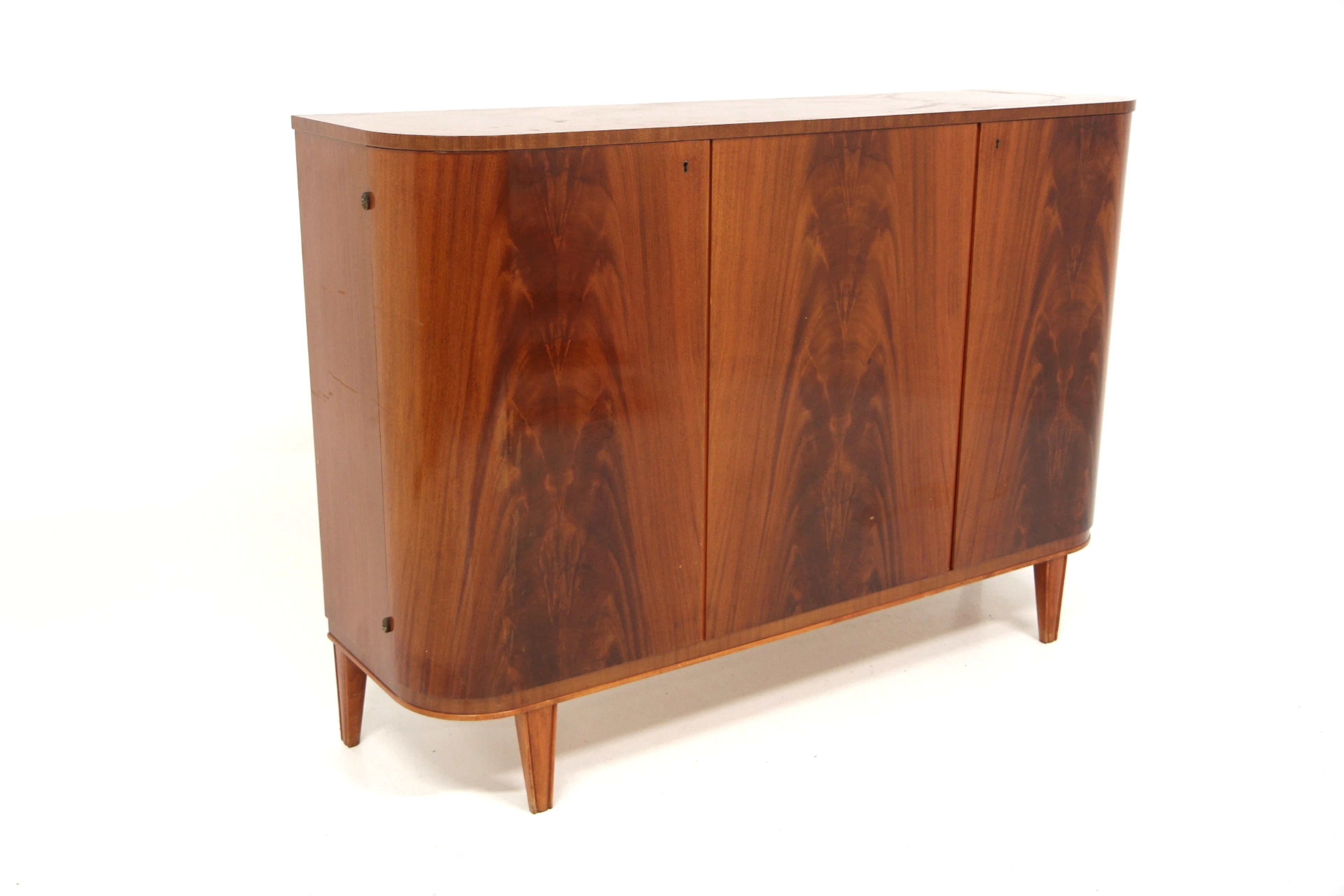 Sideboard Swedish Modern Year: 1940s Origin: Swe. Material: Mahogany