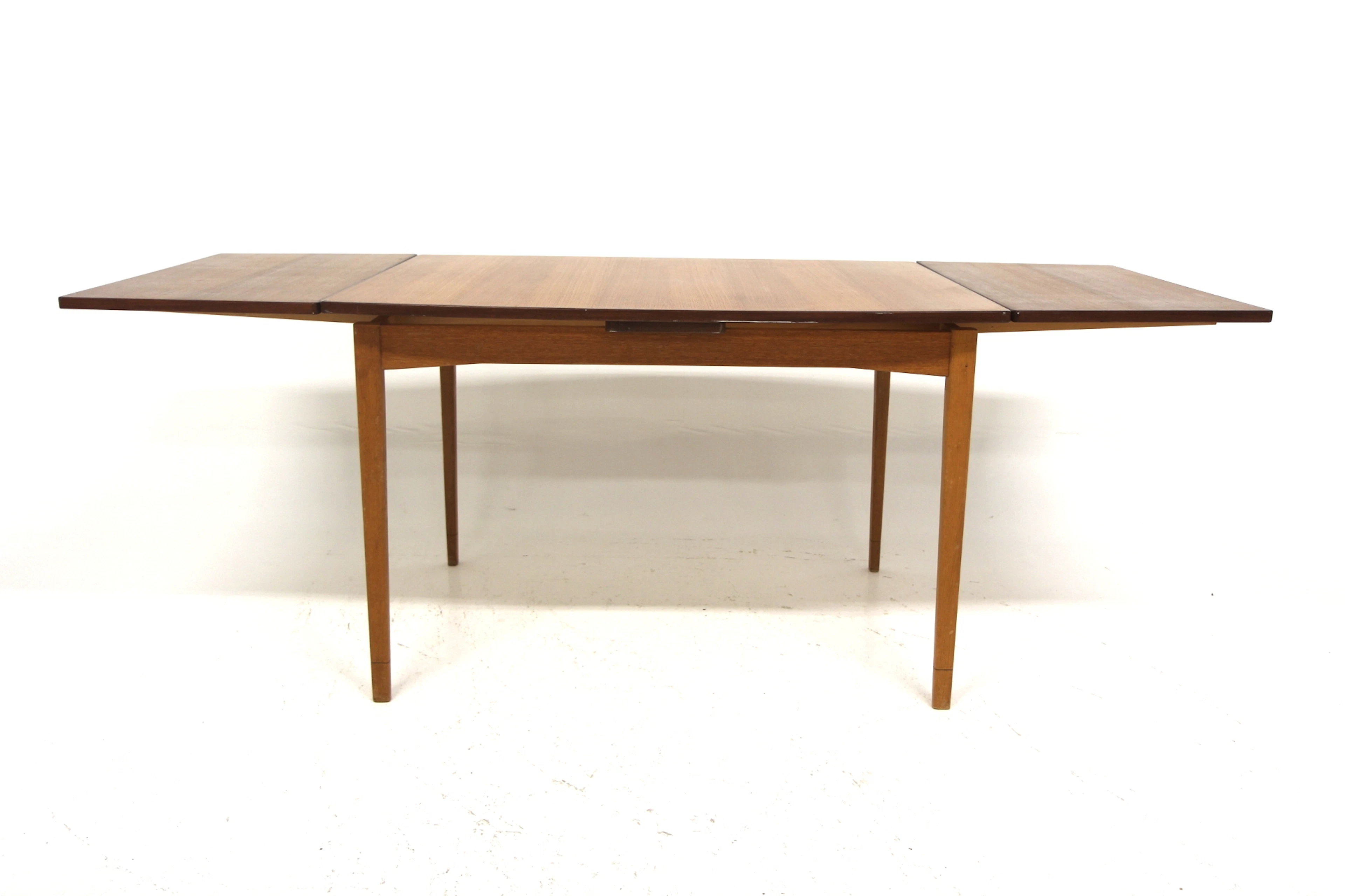 Dining table Year: 1950s Origin: Swe. Material: Teak Oak W: 115 +45