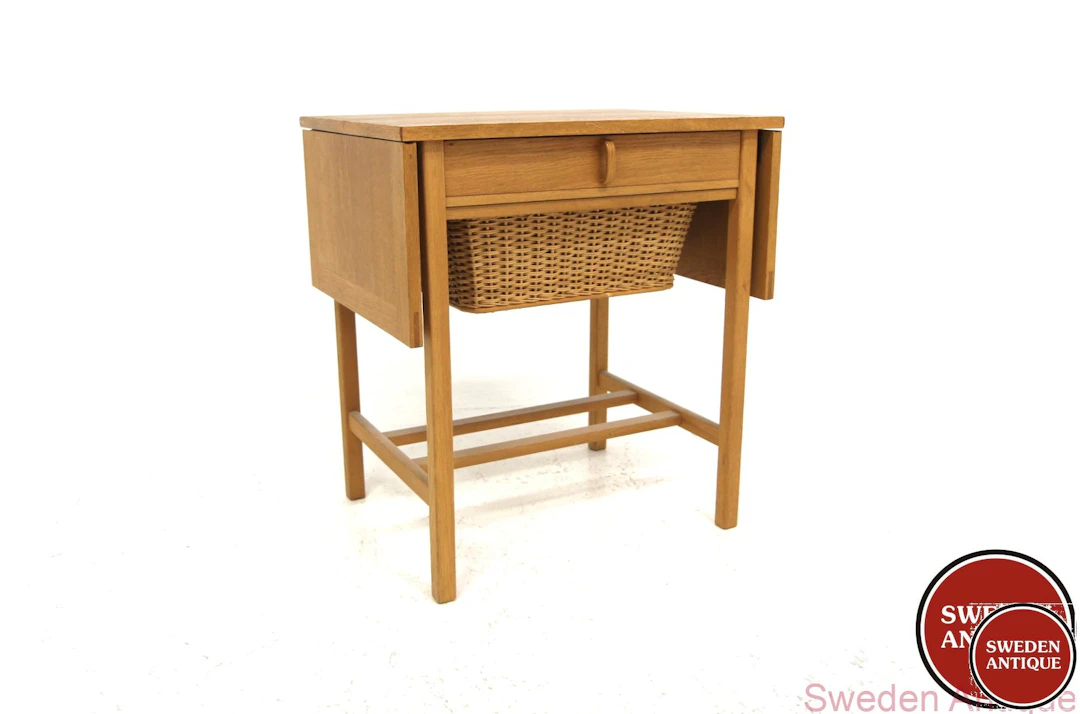 Sewing table Year: 1960s Origin: Swe. Material: Oak Rattan W: 59 +25