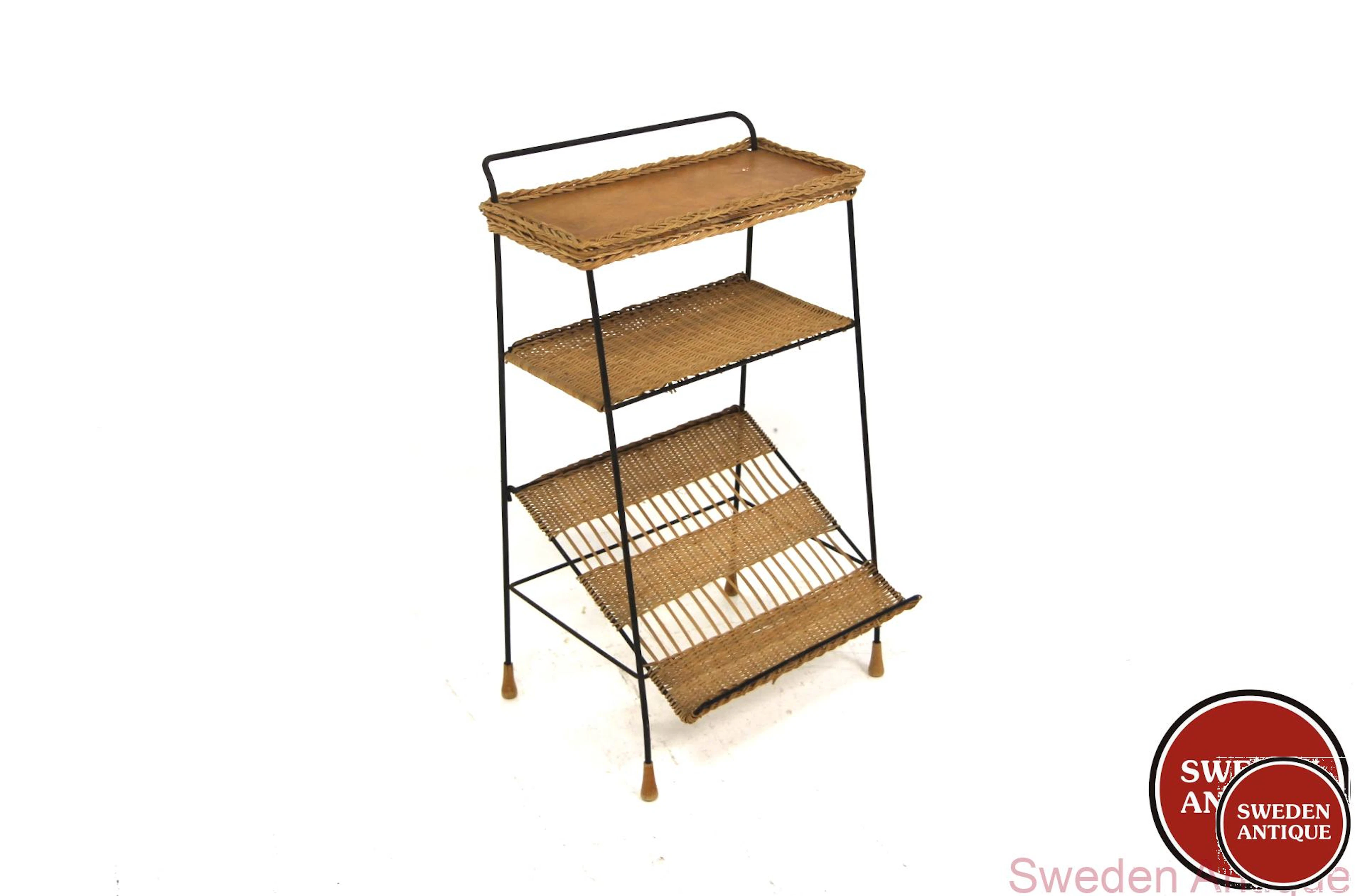 Magazine stand Year: 1950s Origin: Swe. Material: Rattan Metal Beech