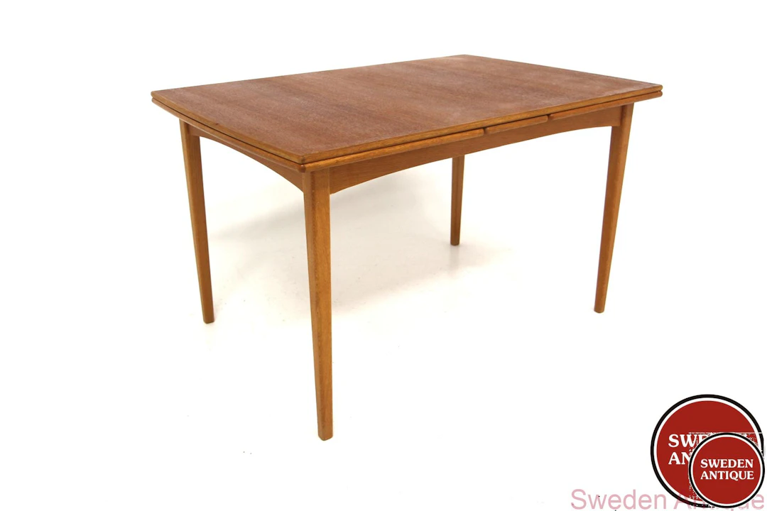 Dining table Year: 1960s Origin: Swe. Material: Teak Oak W: 124 +49