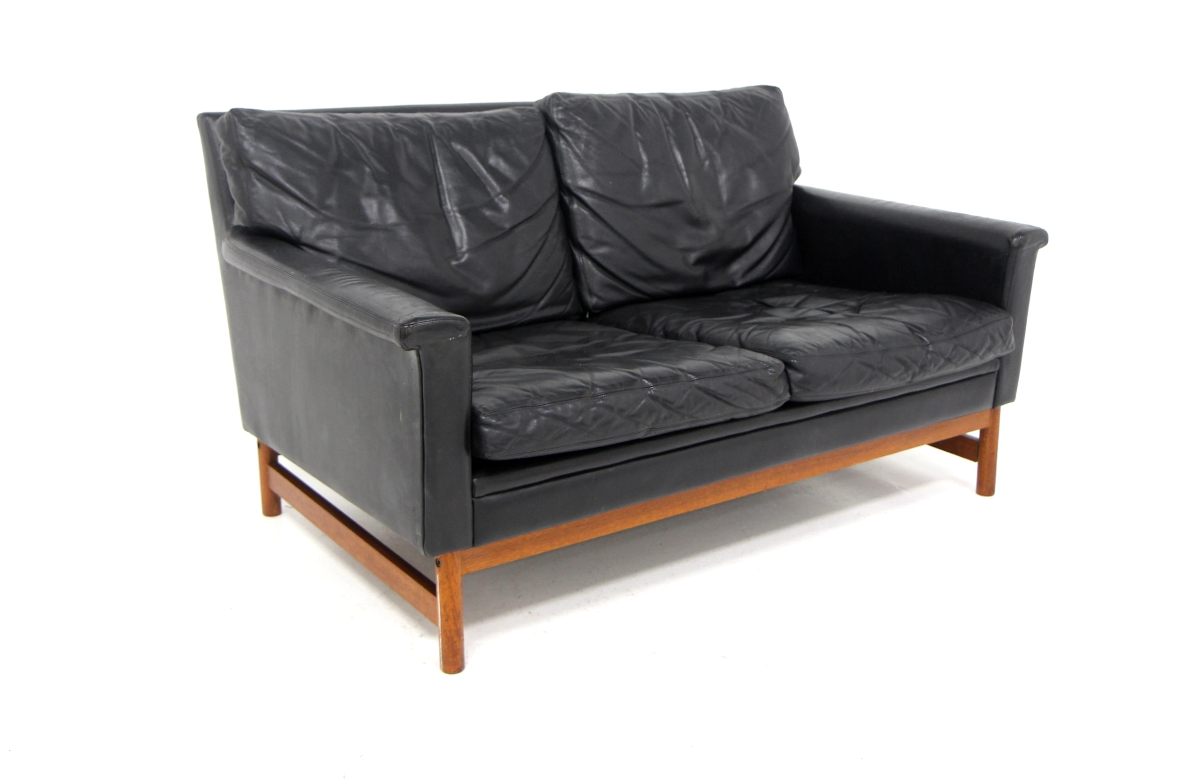2-seat sofa Year: 1950s Origin: Swe. Material: Leather Teak W: 130cm