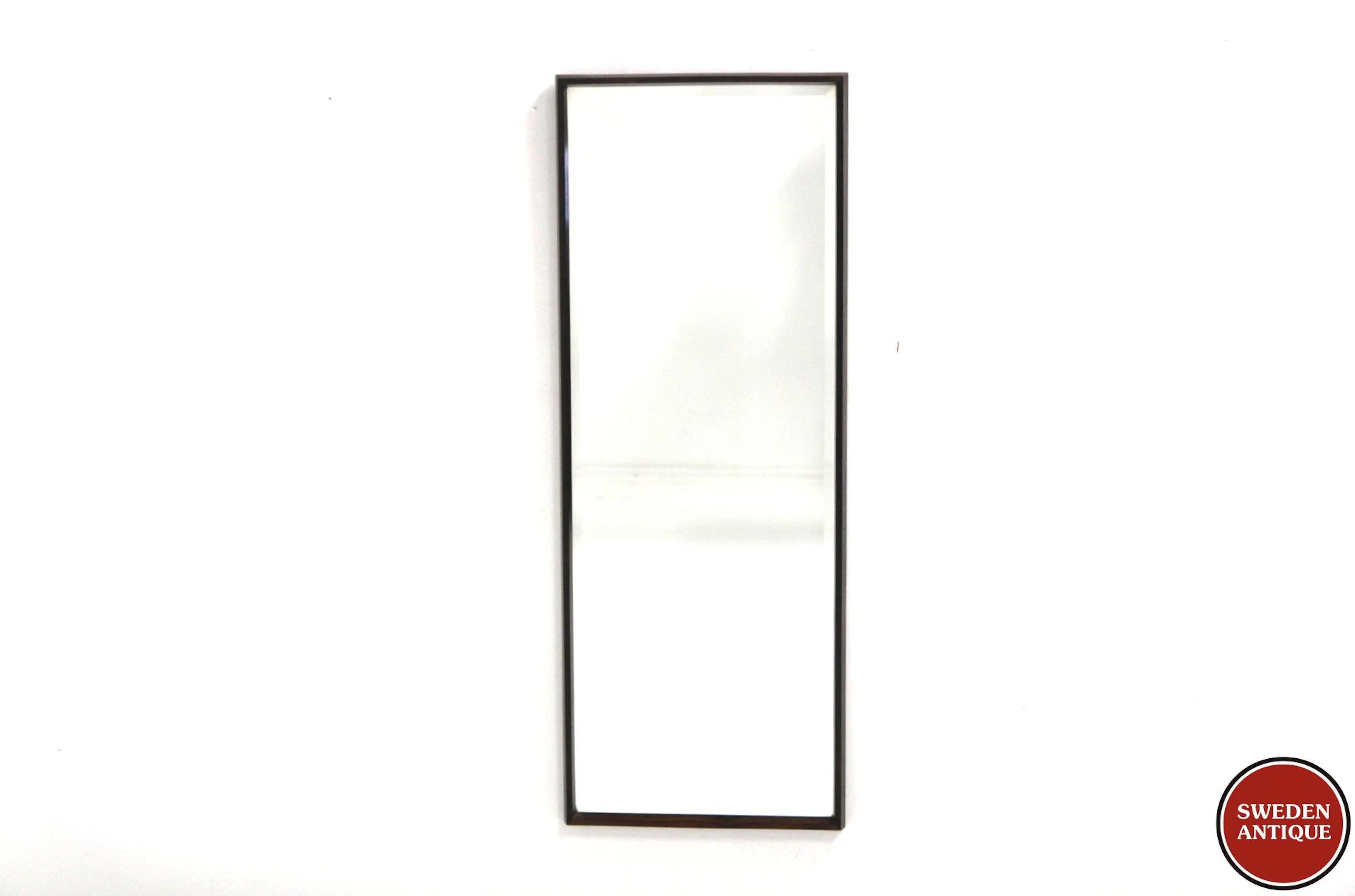 Mirrorwith beveled glass Year: 1960s Origin: Den. Material: Rosewood