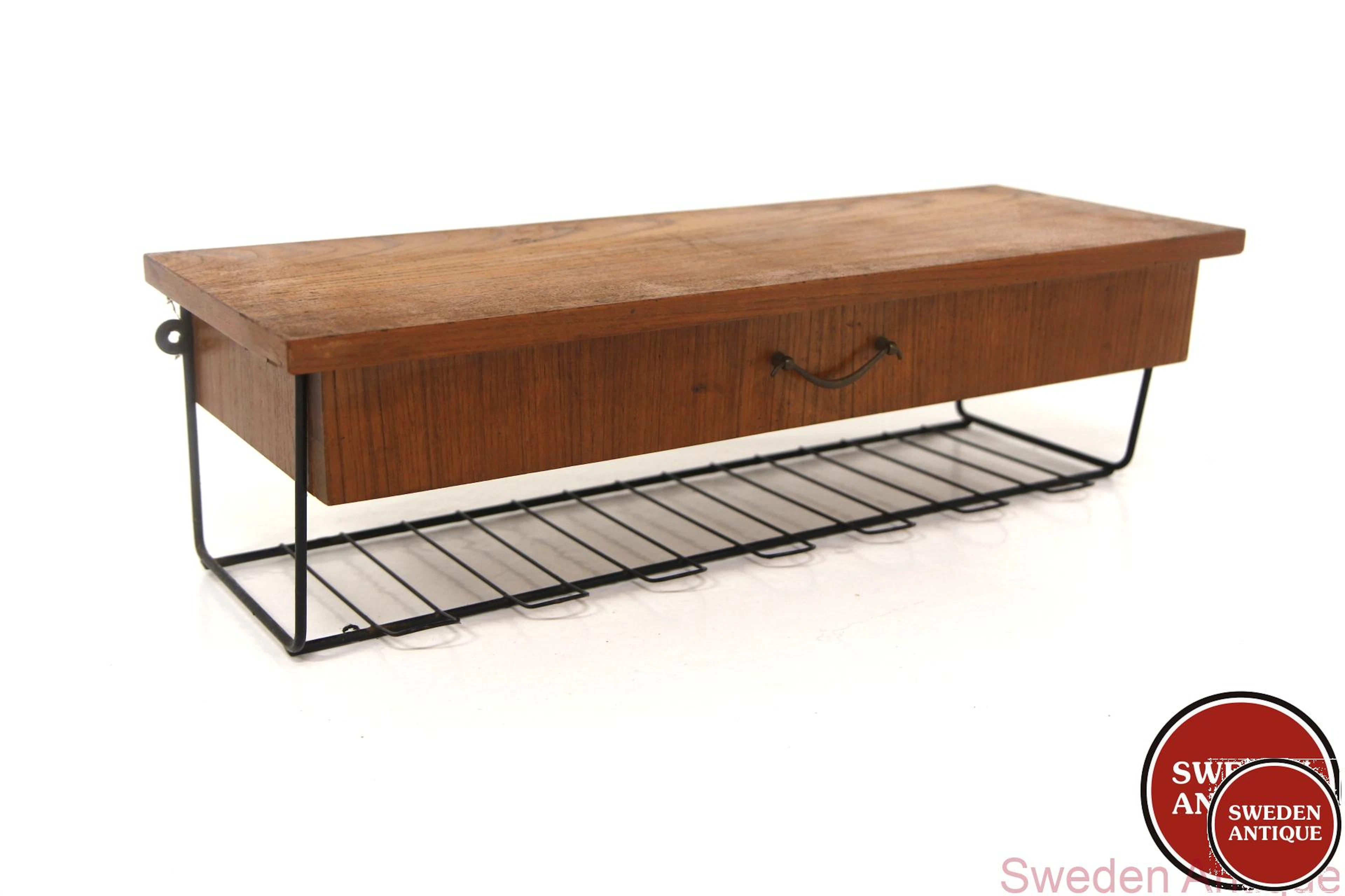 Wall shelf Year: 1950s Origin: Swe. Material: Teak Metal W: 60cm D:
