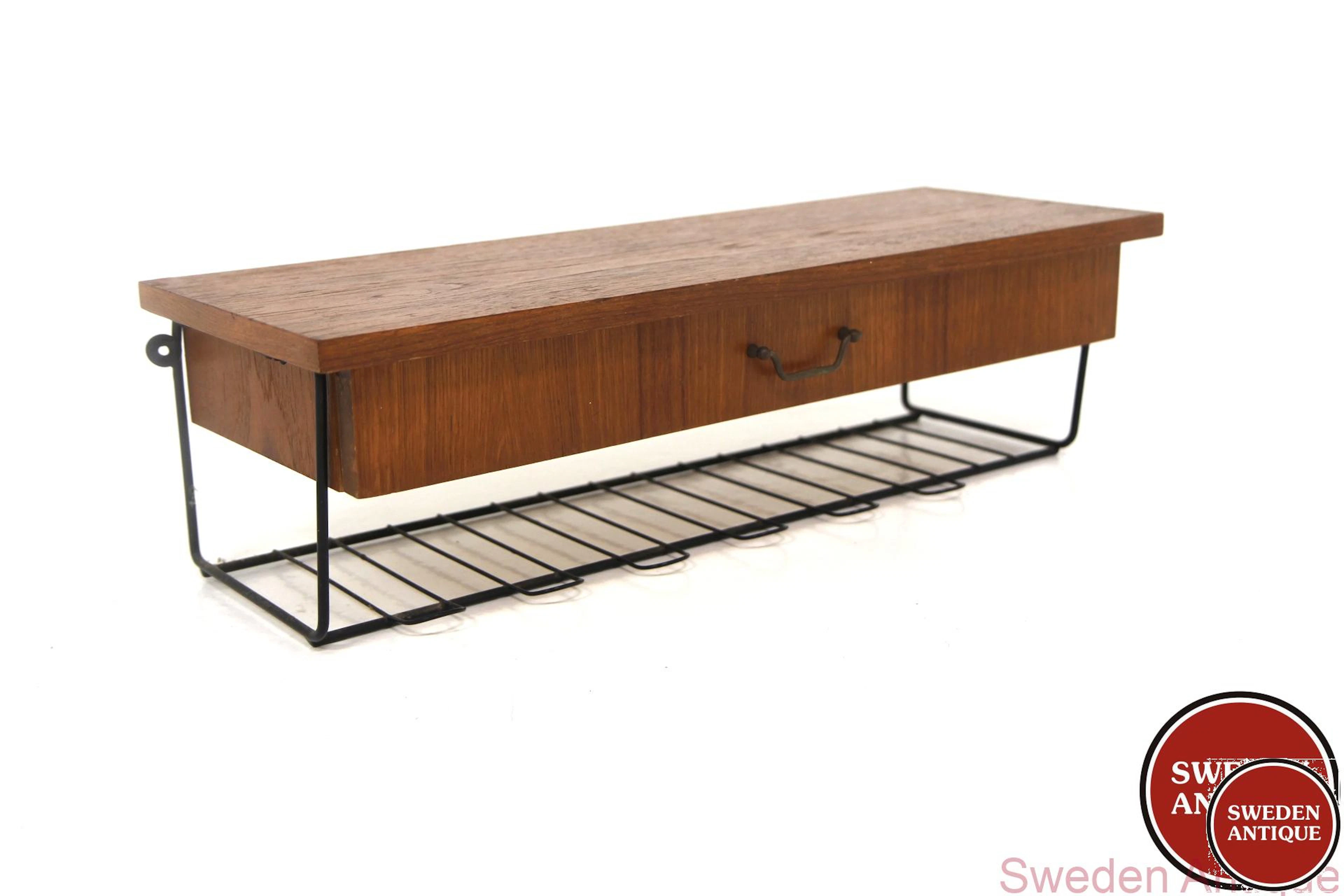 Wall shelf Year: 1950s Origin: Swe. Material: Teak Metal W: 60cm D: