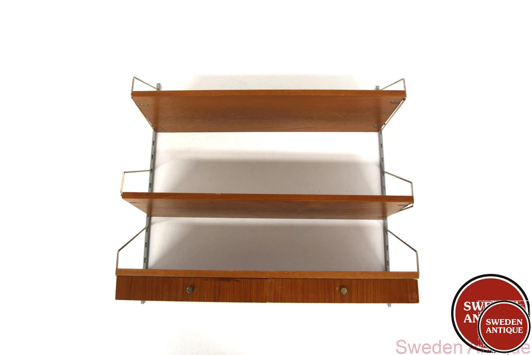 Wall shelf Year: 1950s Origin: Swe. Material: Teak Metal W: 80cm D: