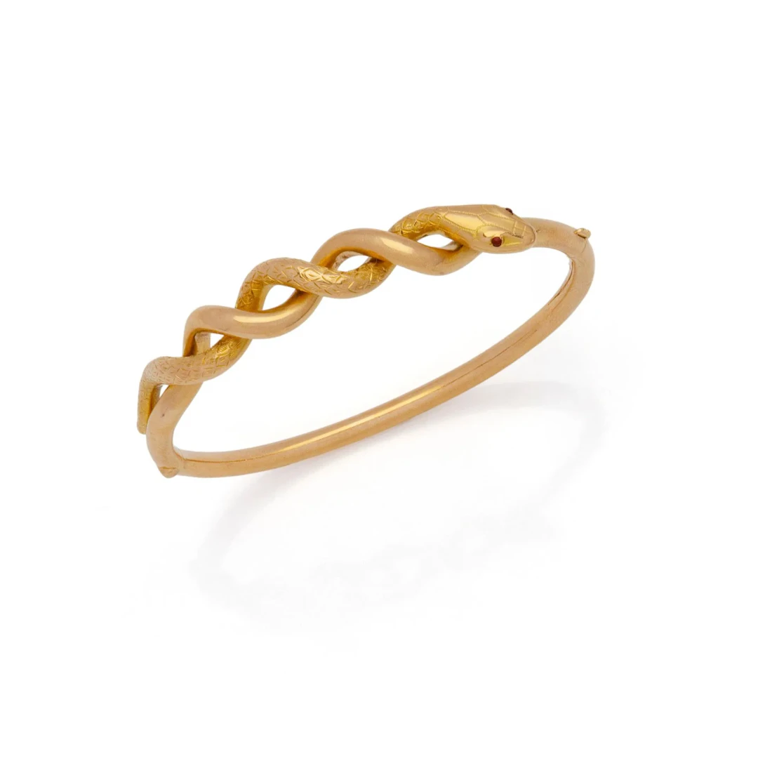 BRACELET RIGIDE SERPENT en or jaune 18K (750/1000) torsadé - Lot 37