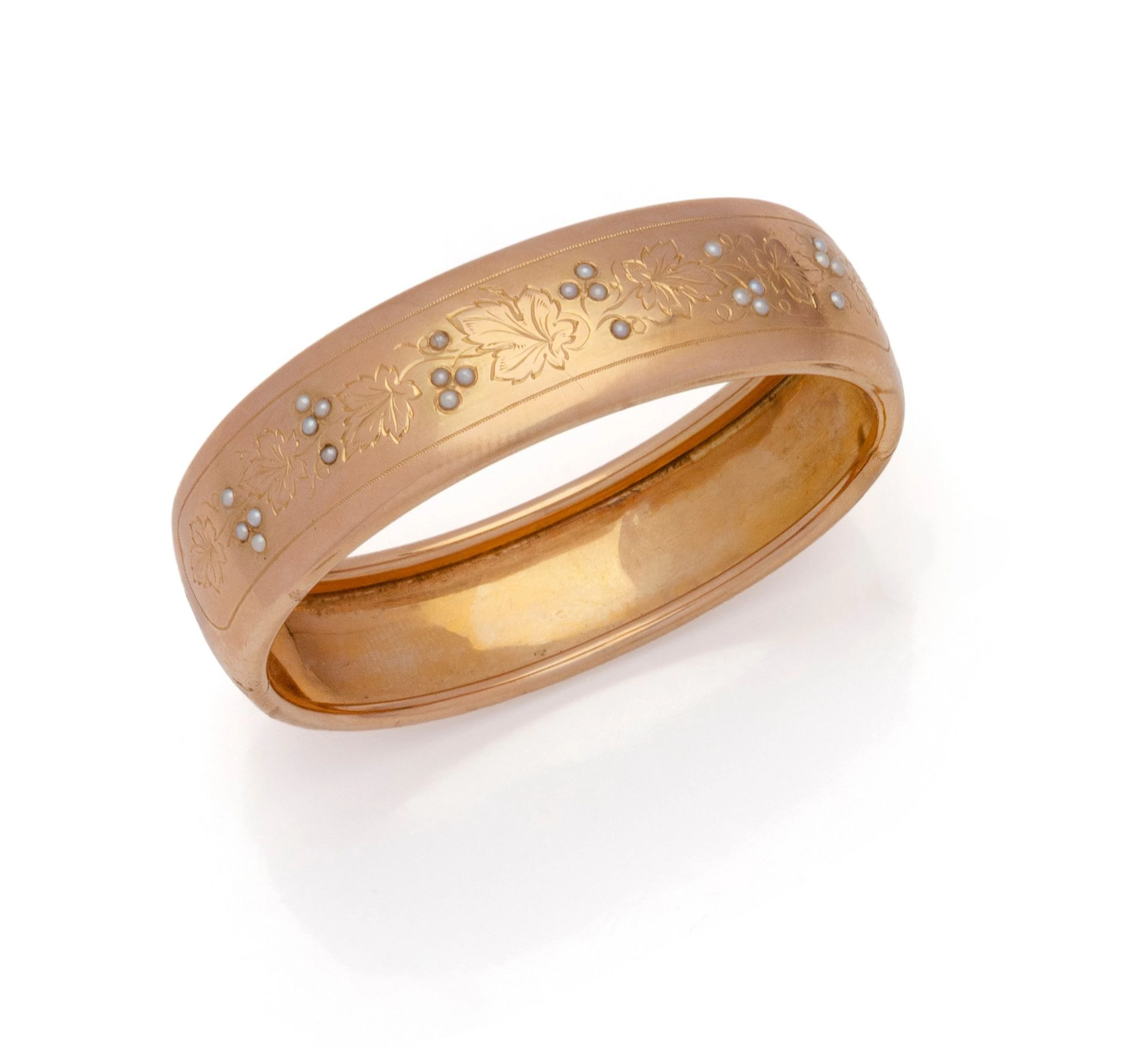 BRACELET rigide en or jaune 18K (750/1000) ciselé de feuille - Lot 41